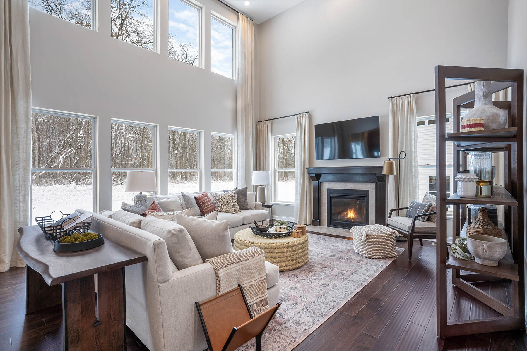 2-Story Great Room With Fireplace and Bookshelves