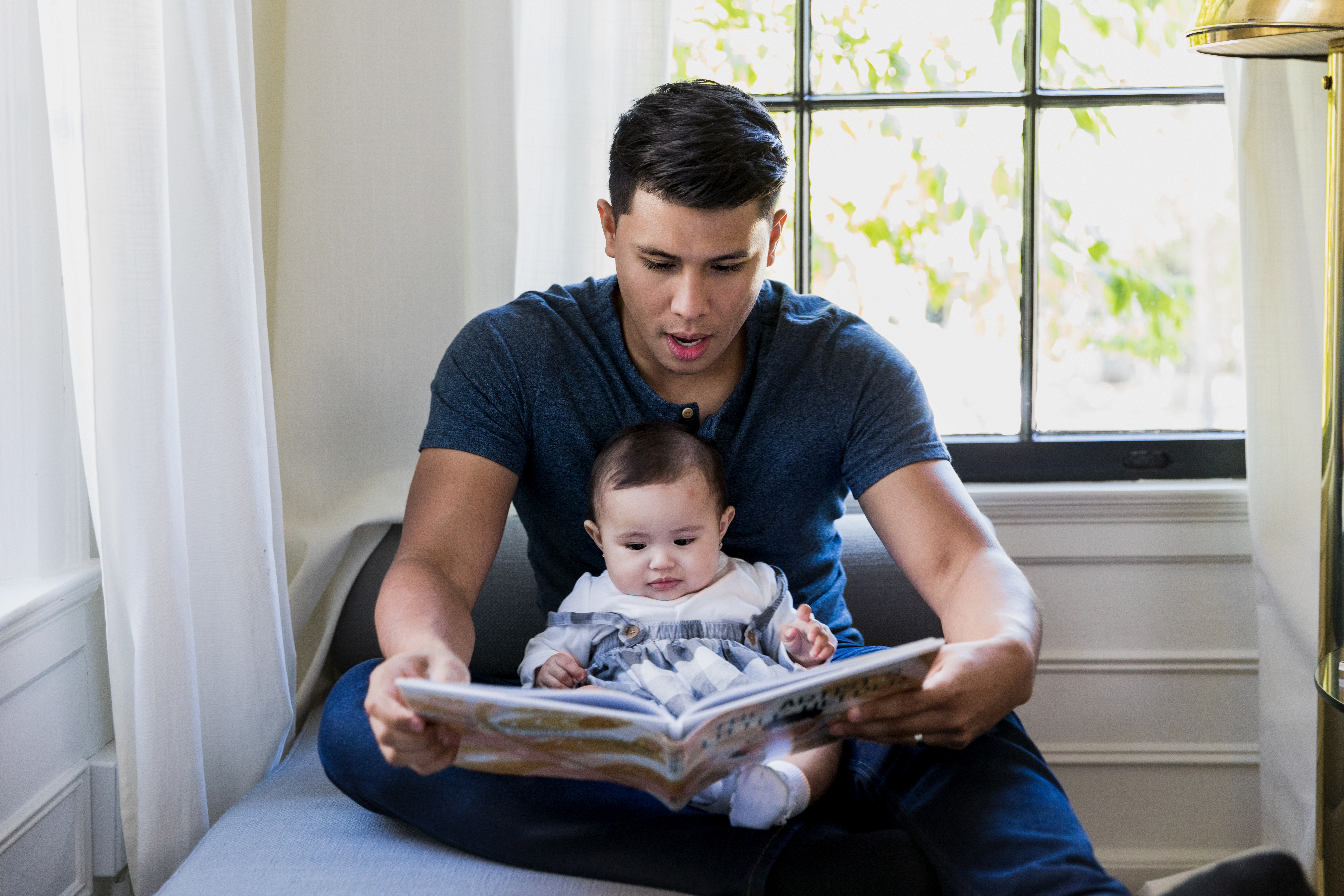 Parent Reading Book to Baby