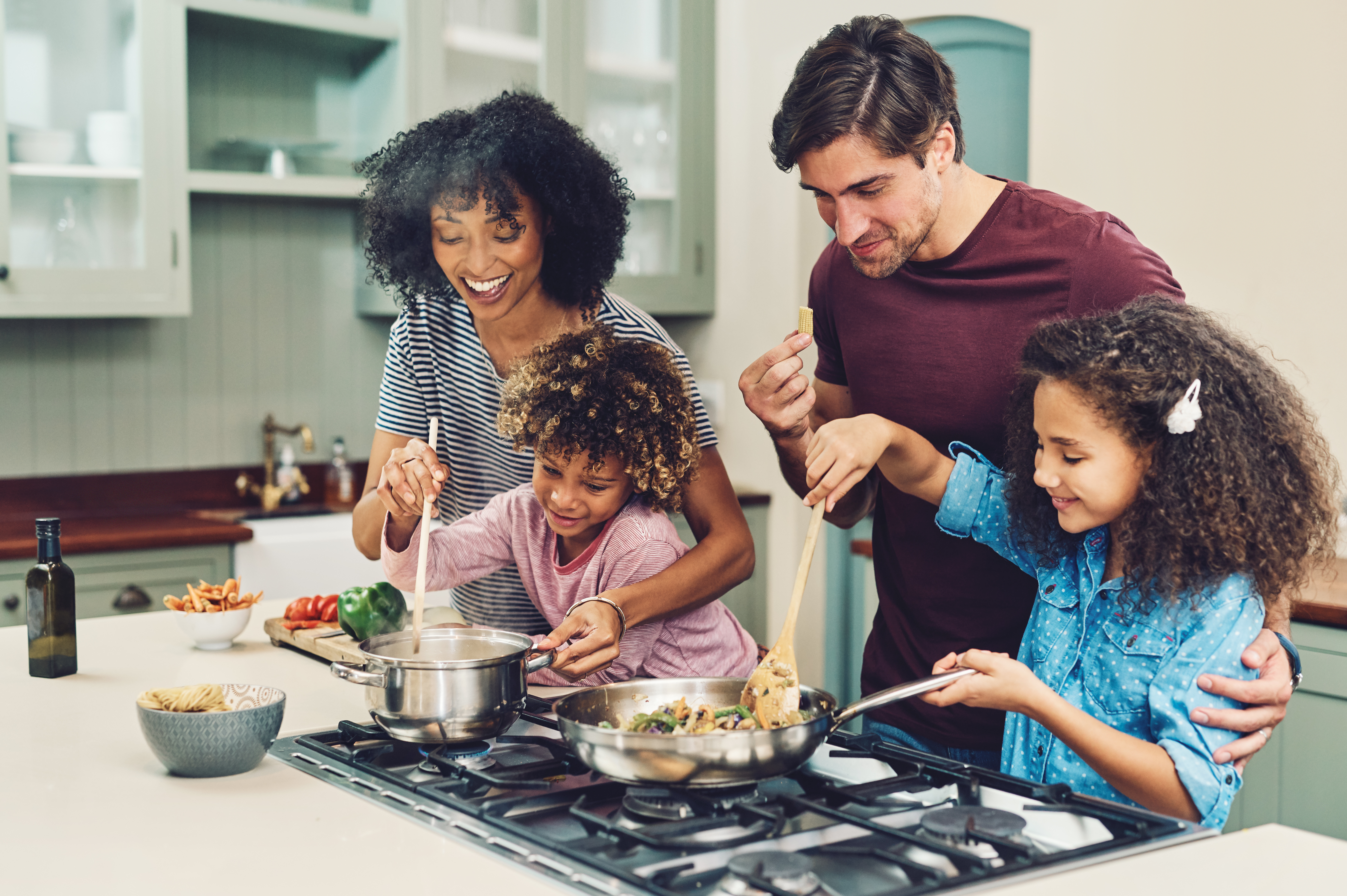 Family of 4 cooking together