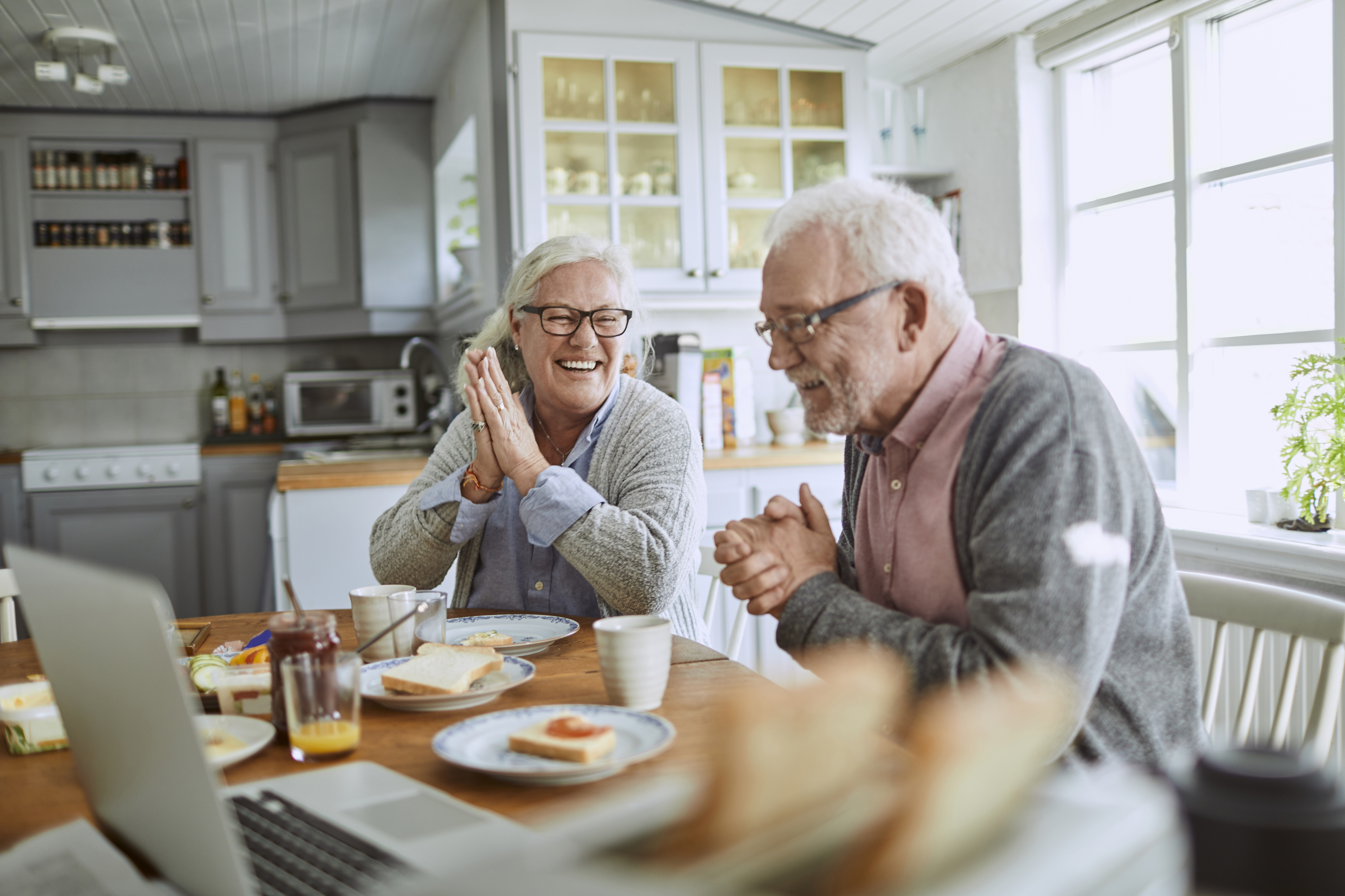 Couple Enjoying Breakfast in Kitchen