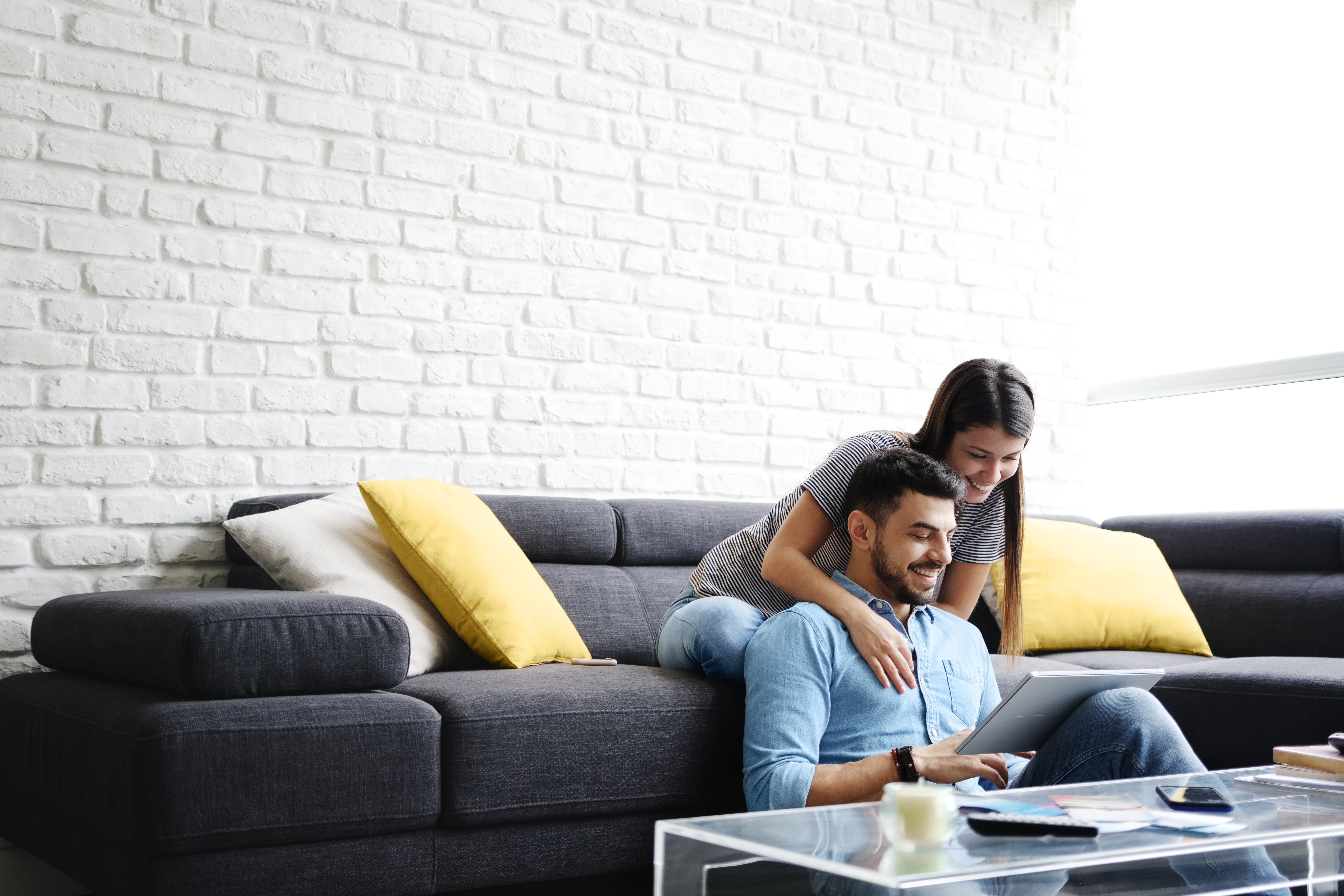 Couple Planning Budget on Laptop