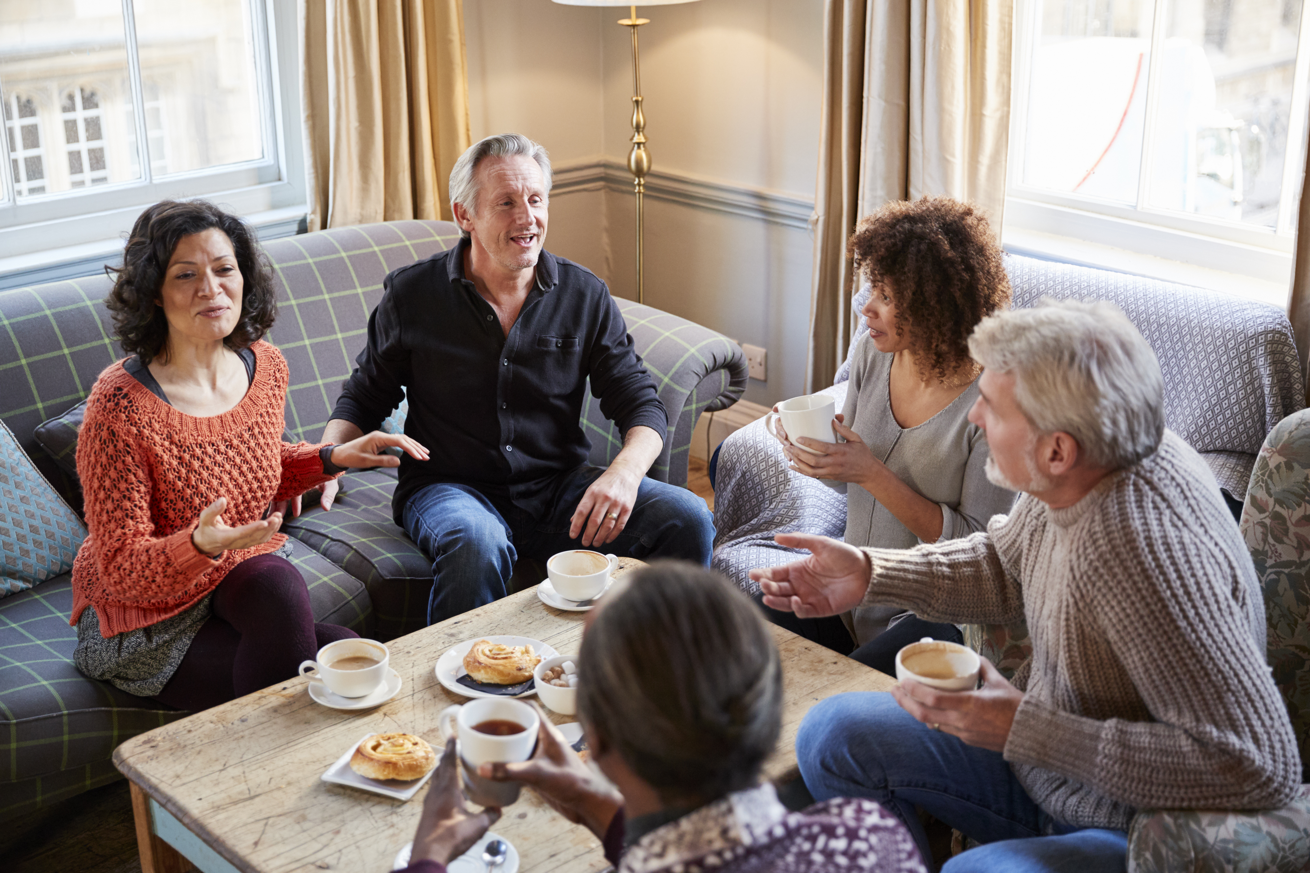 Friends Having Coffee and Pastries Together