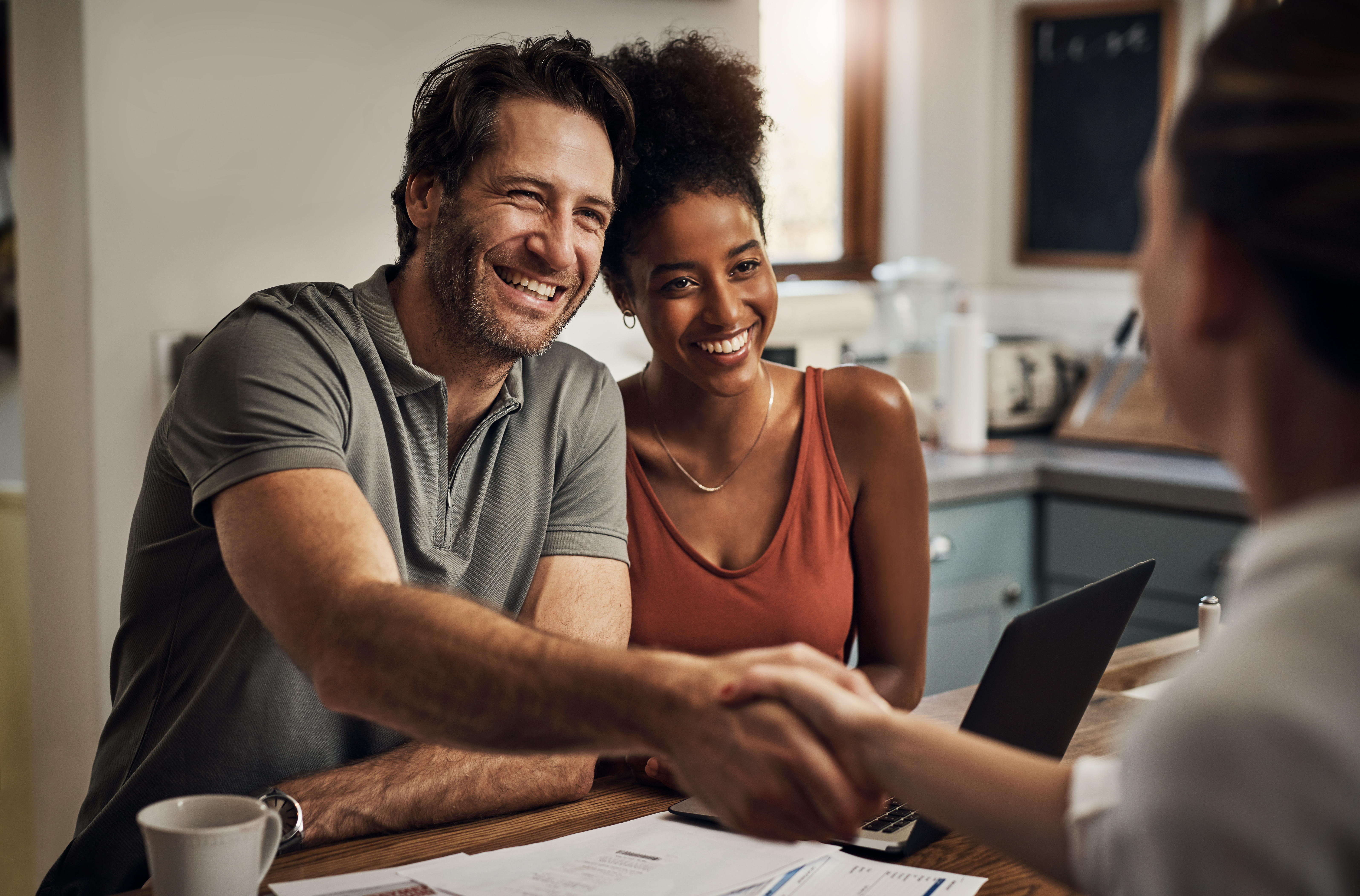 Couple Shaking Hands With Agent