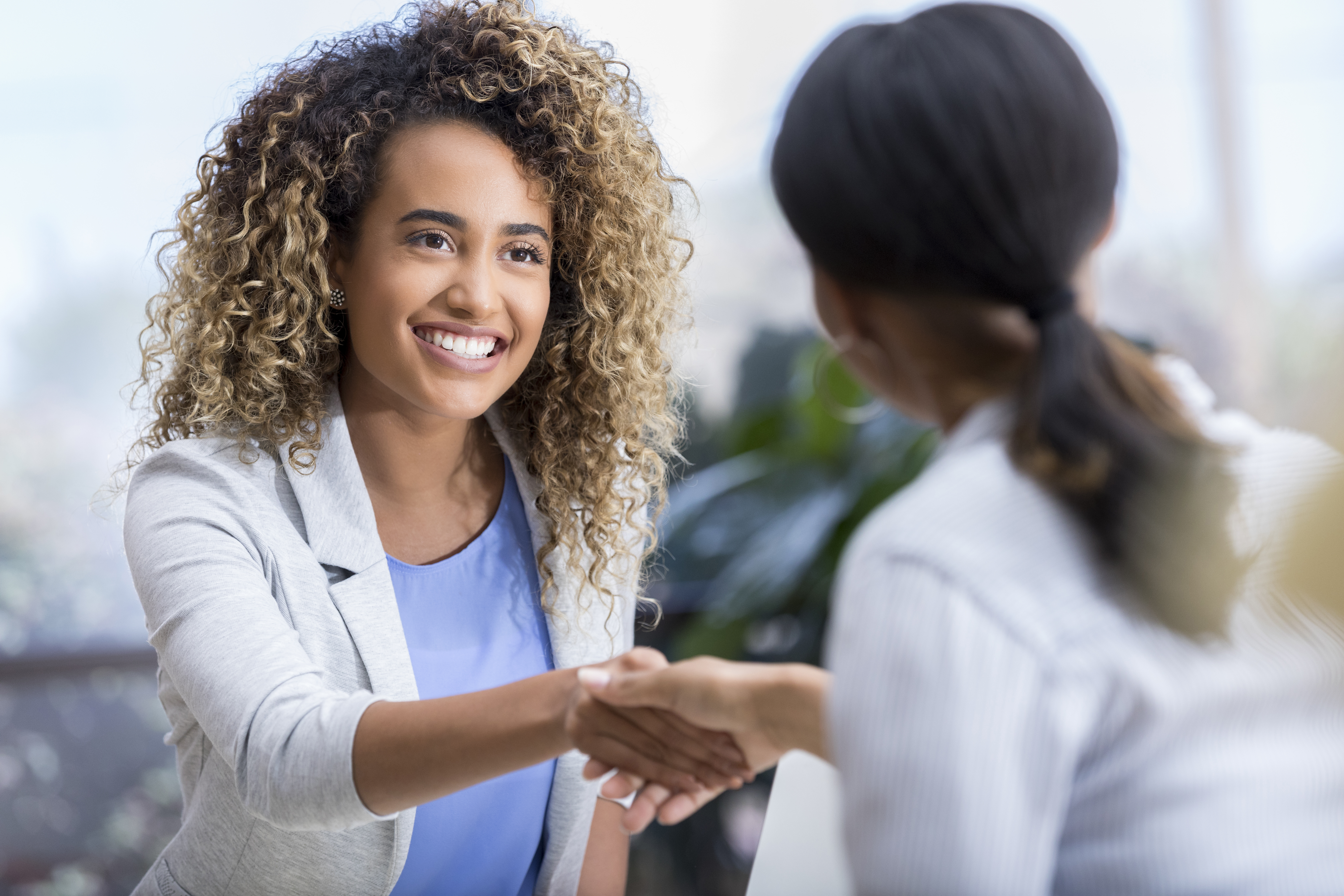 Woman Shaking Hands With Lender