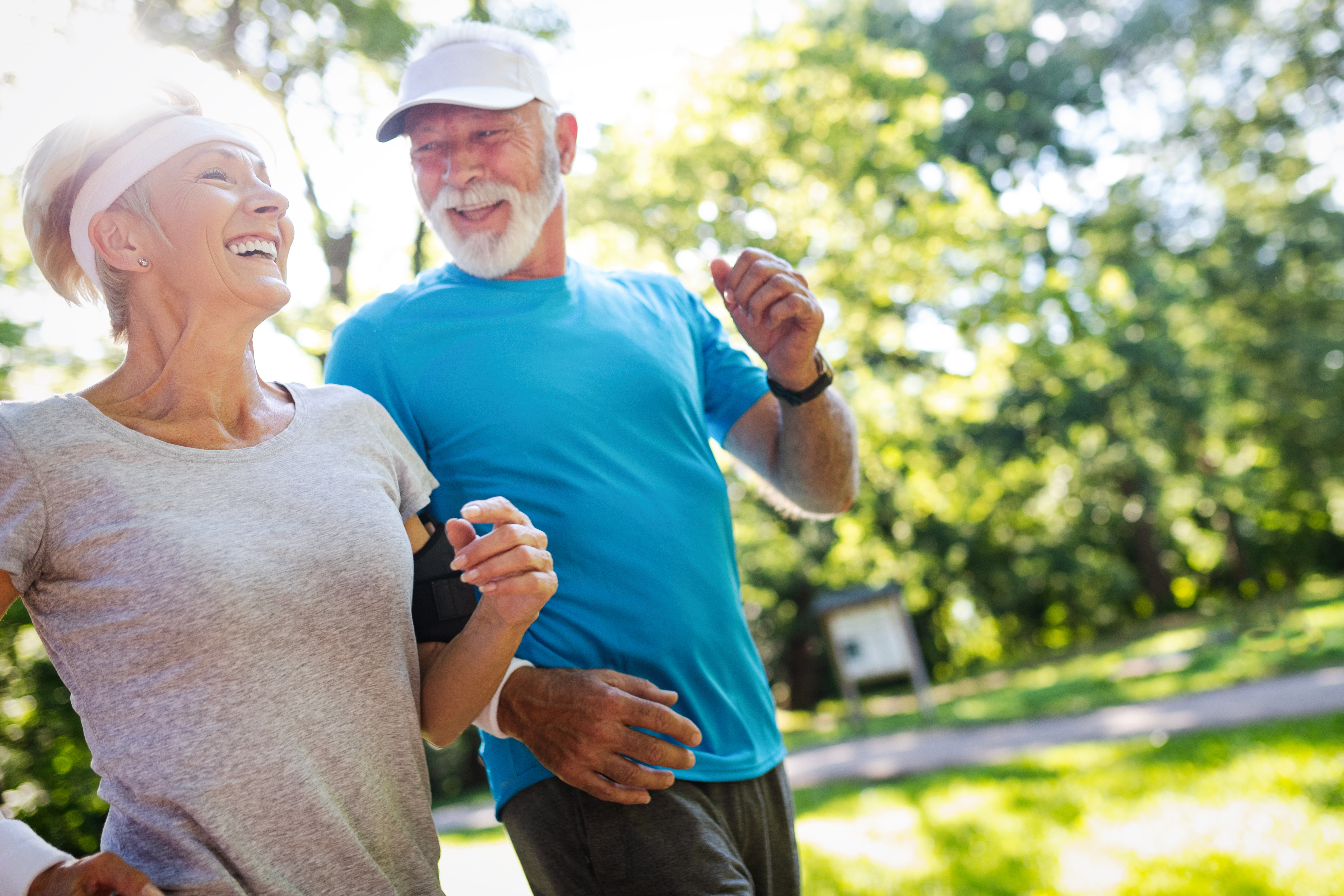 Elderly Couple Jogging in Park