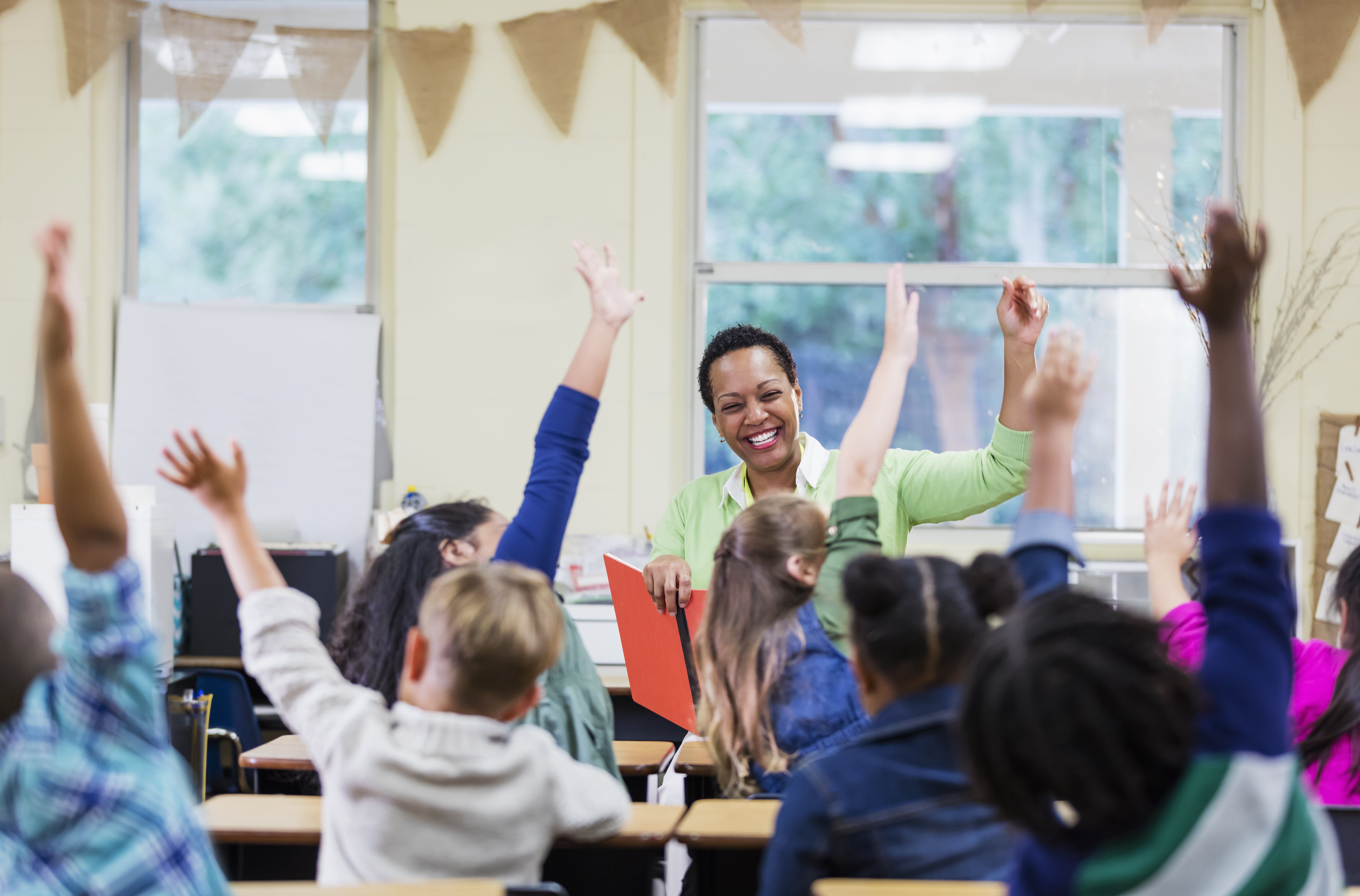 Children and Teacher in School