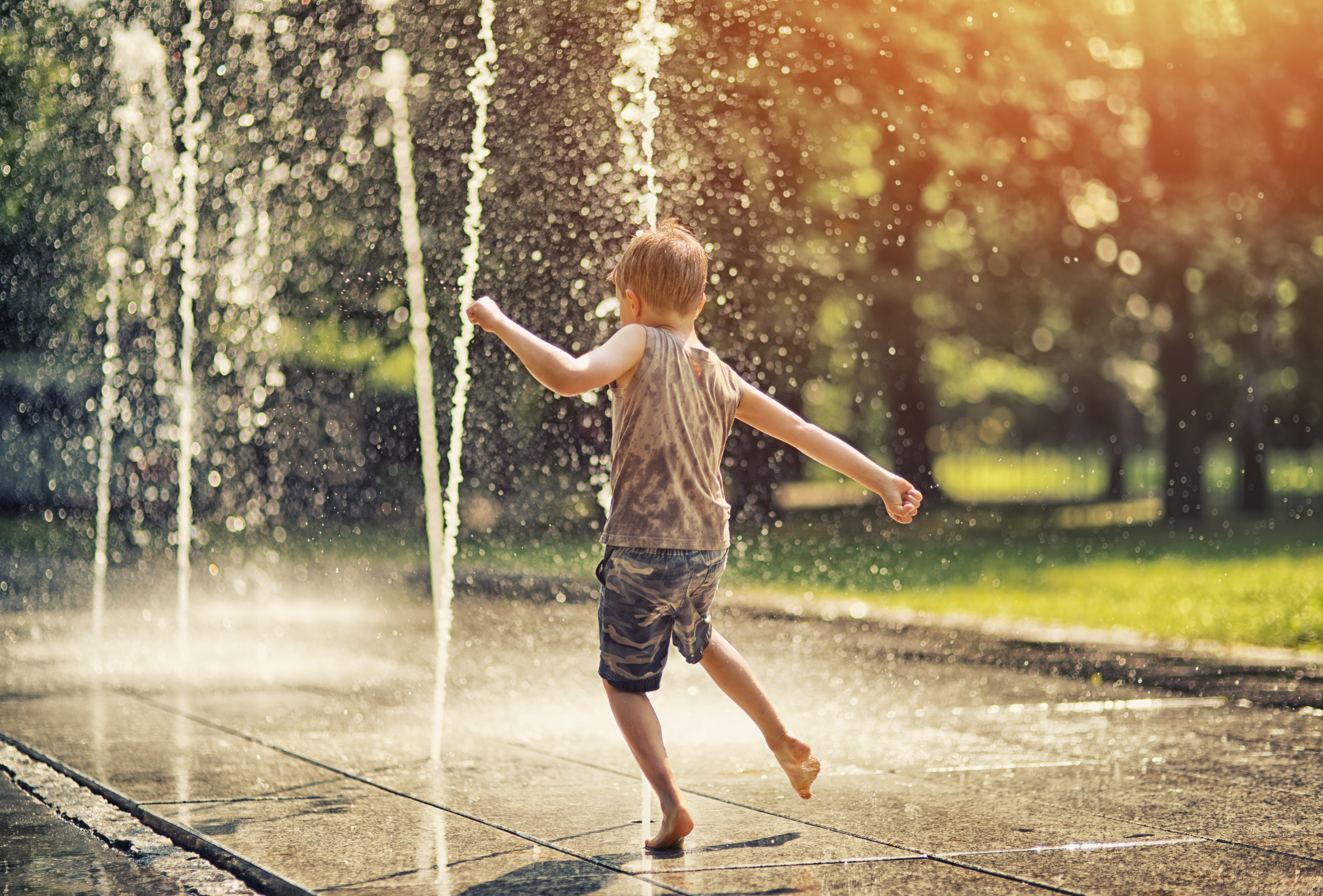 Kid Playing on Splash Pad