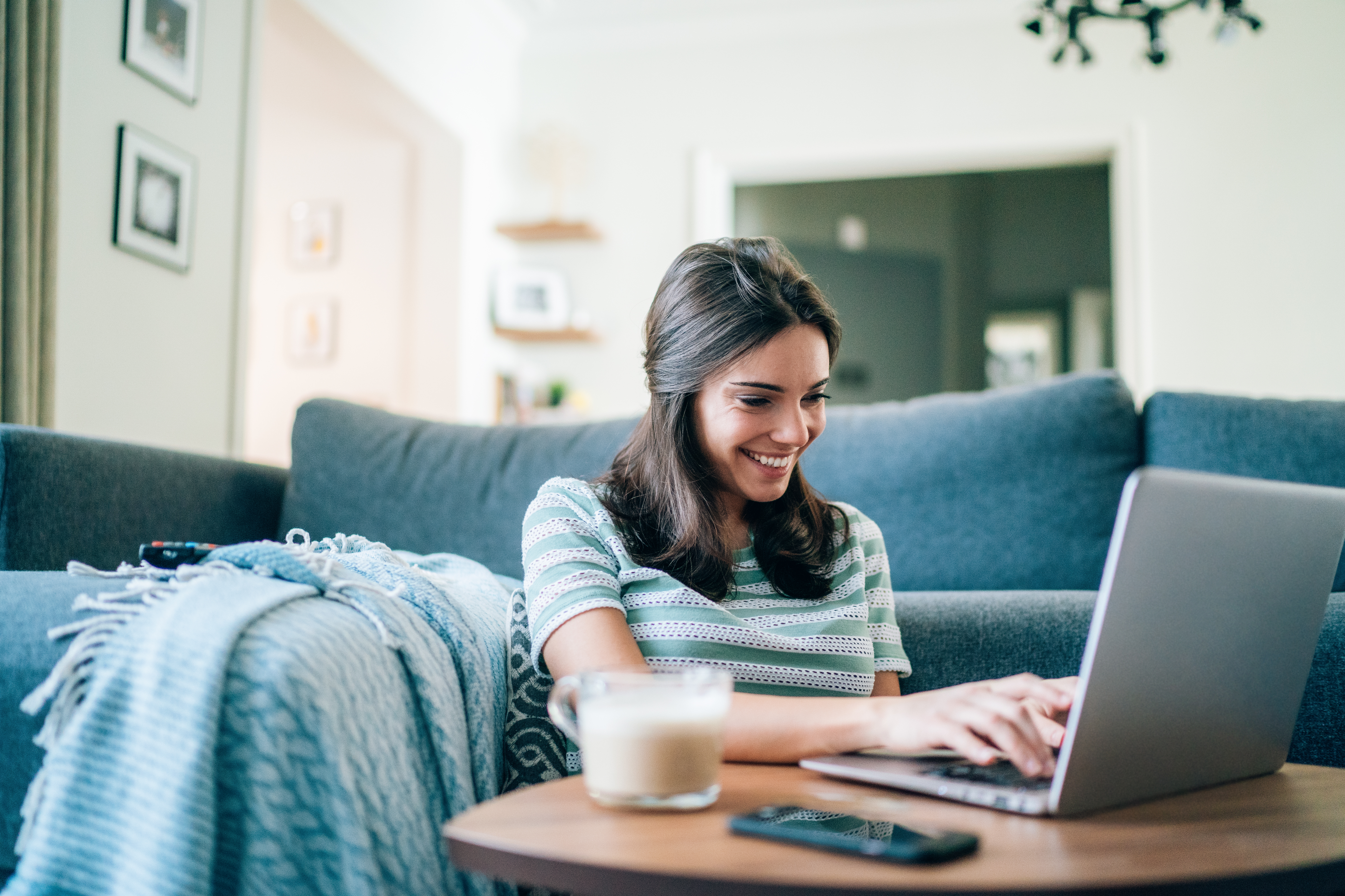 Woman Browsing on Laptop