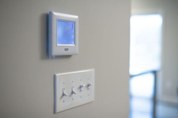 Photo of a modern thermostat in a home