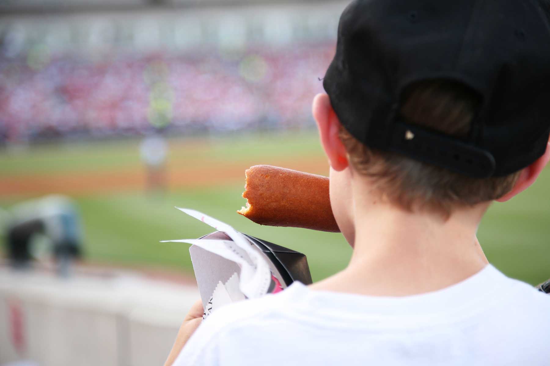 Kid watching baseball game