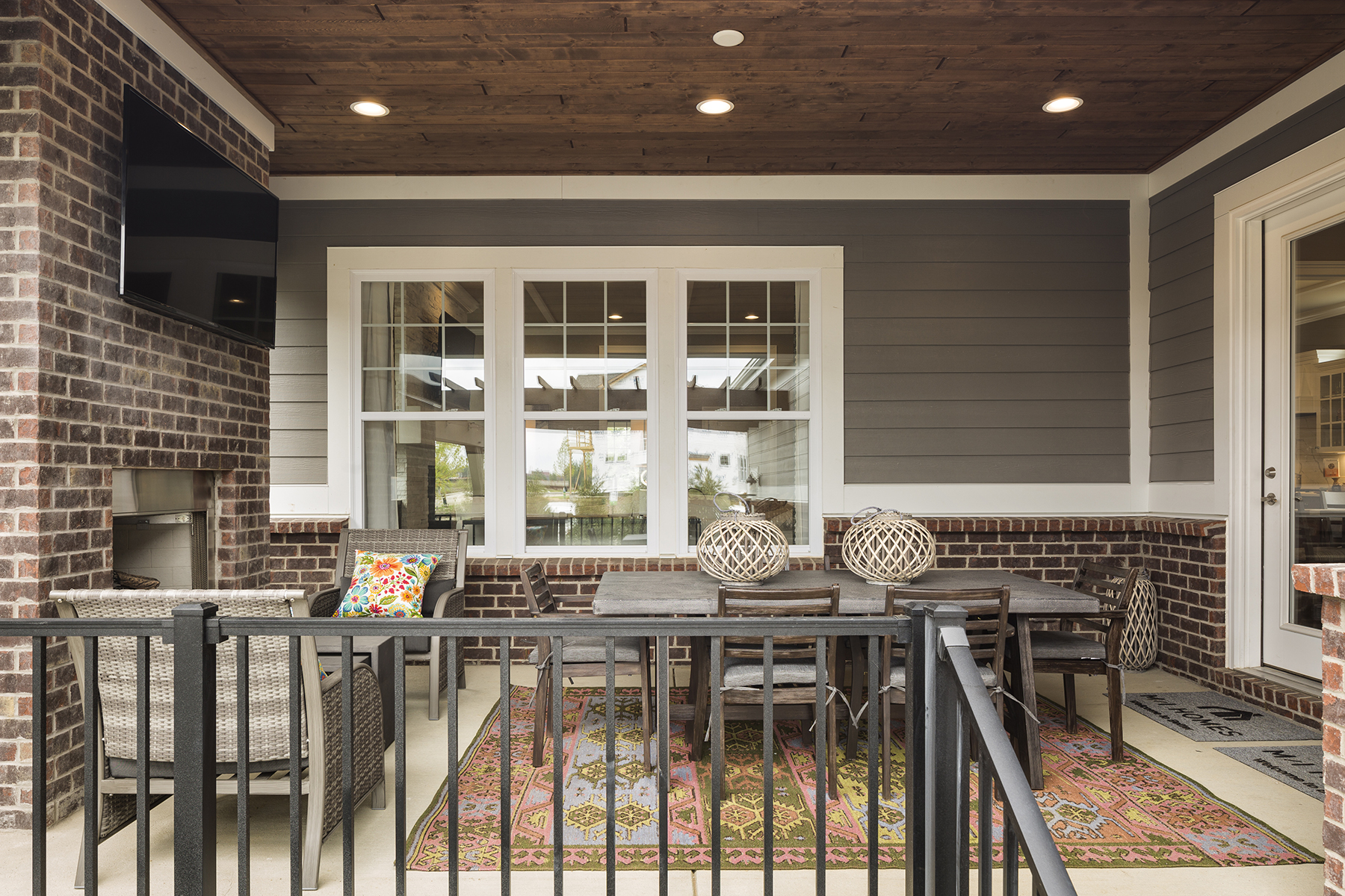 Covered Patio With Outdoor Rug and Furniture