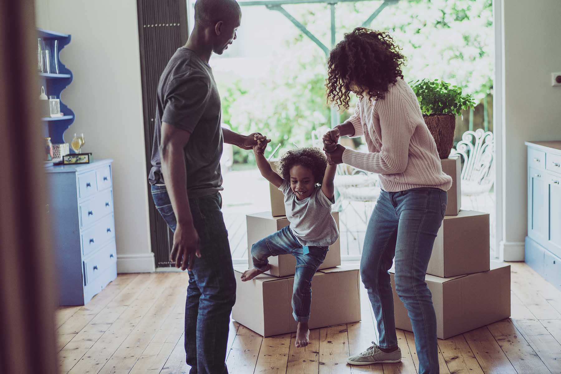 Family Dancing at Home on Moving Day