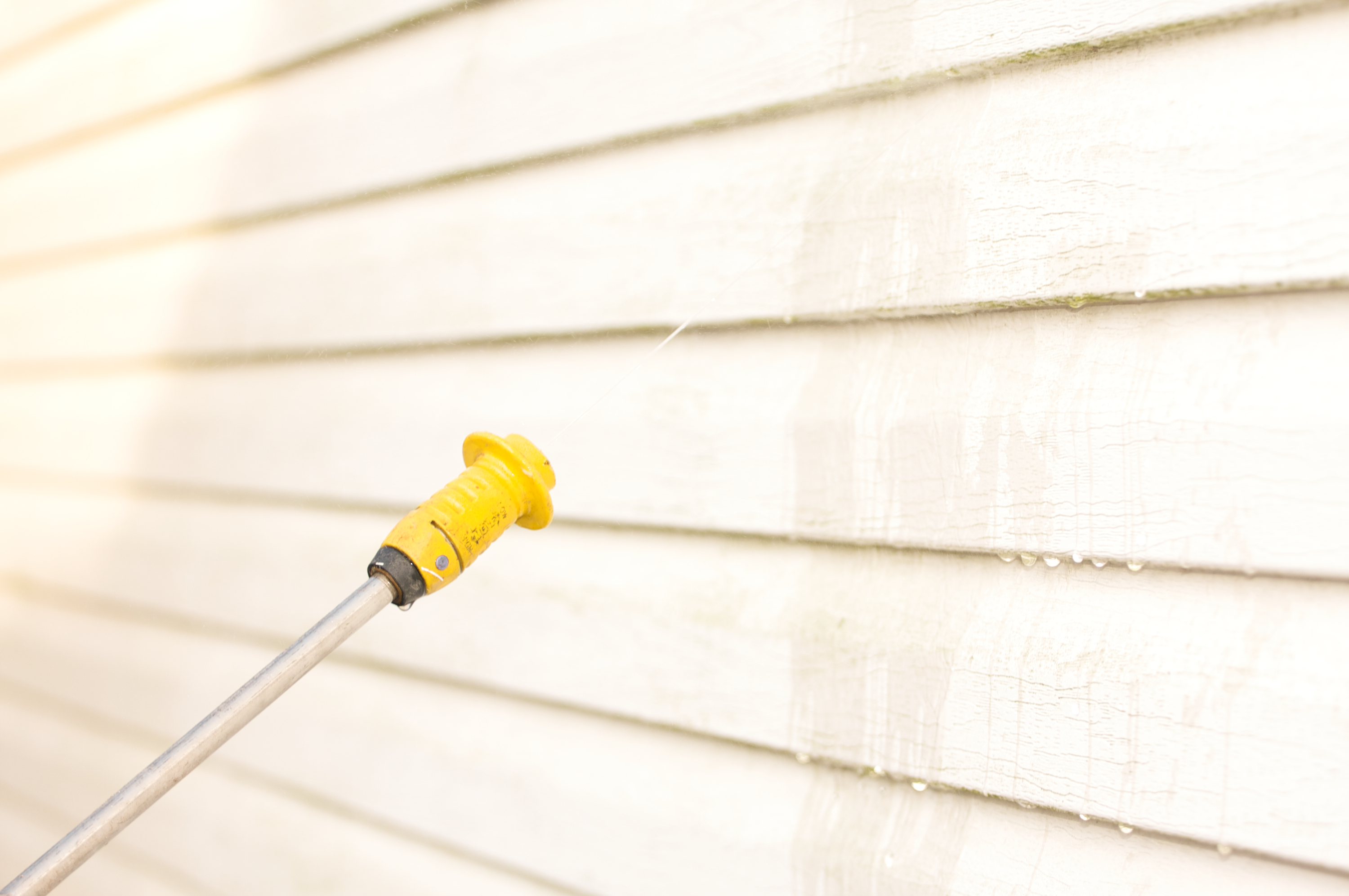Pressure Washer Cleaning Exterior Walls
