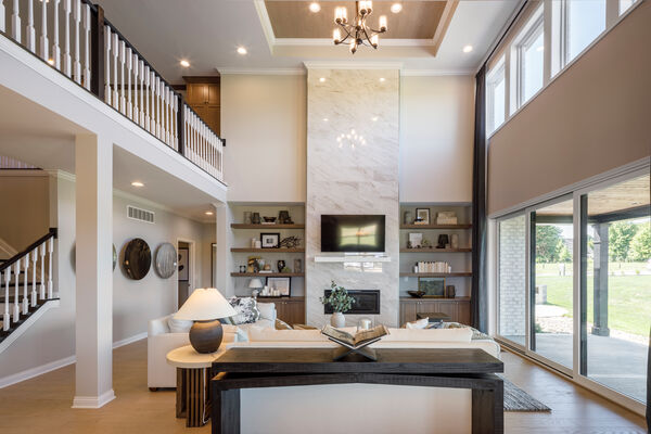 Image of a great room with a floor-to-ceiling marble fireplace