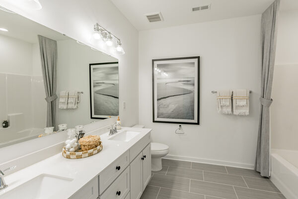 Bathroom With Frameless Mirror