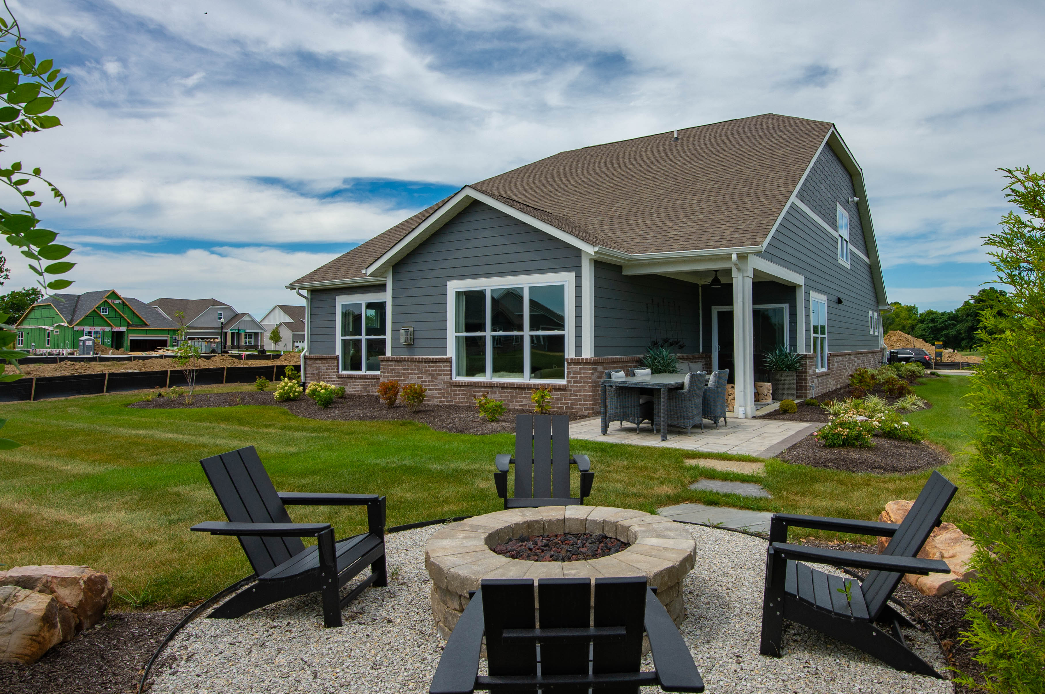 Backyard With Firepit and Adirondack Chairs