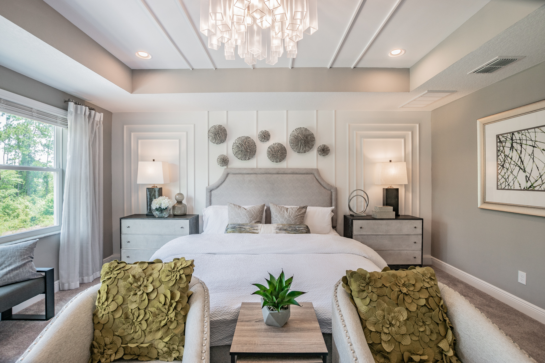 Bedroom With Elegant Chandelier and Bedside Table Lamps