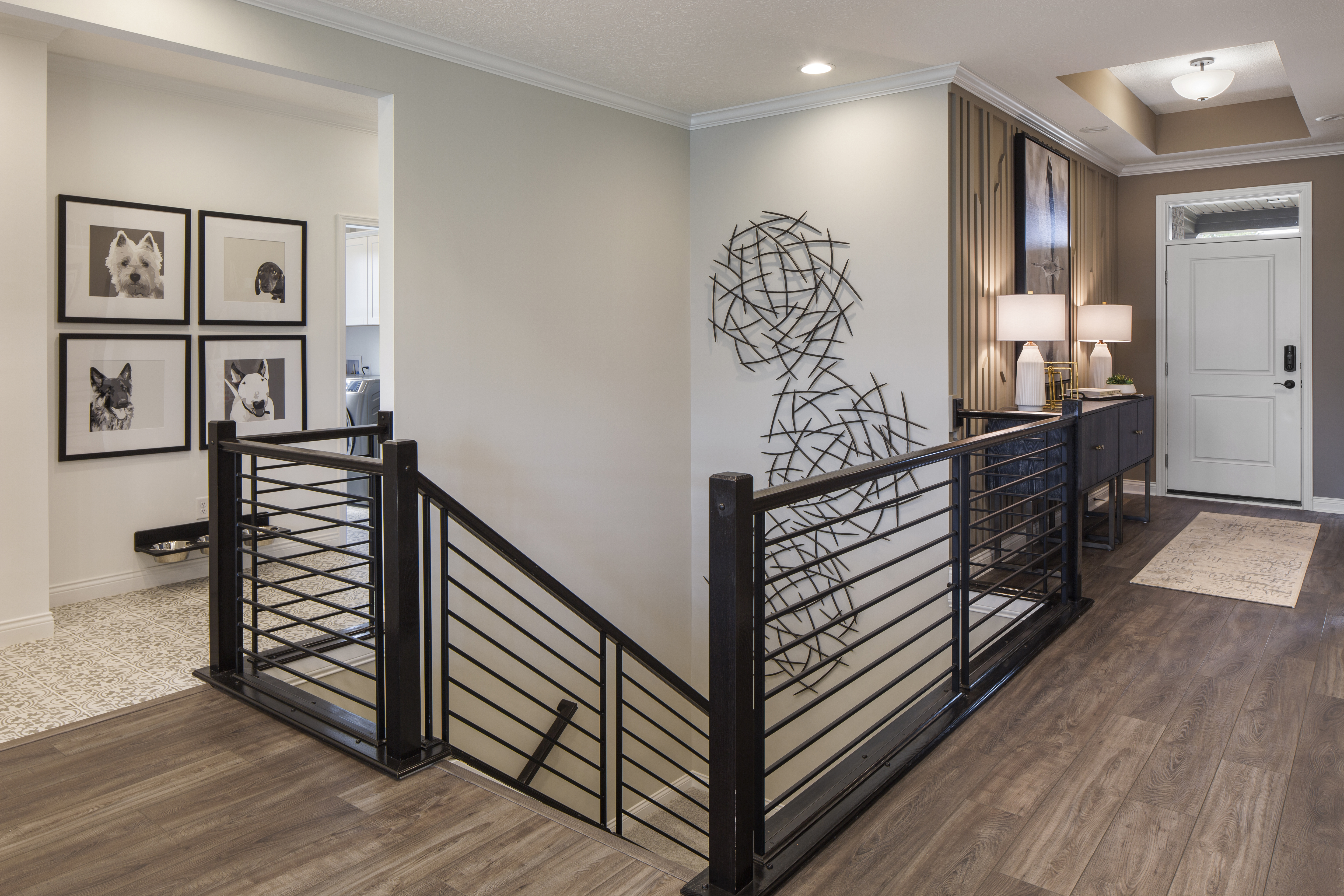 Modern industrial staircase with black abstract artwork on stair wall