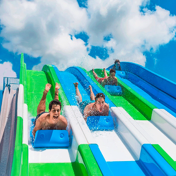 Kids Going Down Slide at Water Park