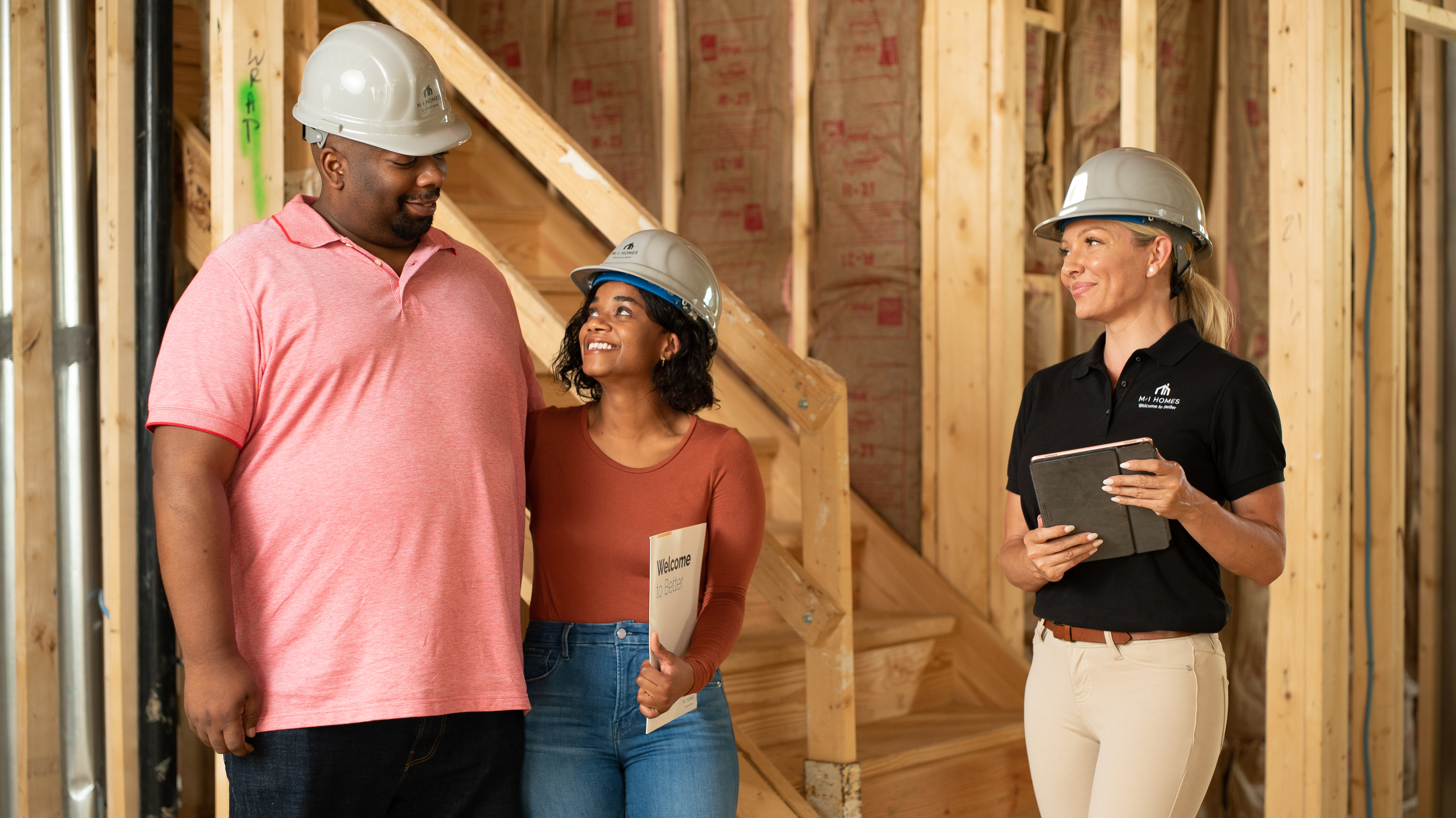 Construction Manager With Clients in Under Construction Home