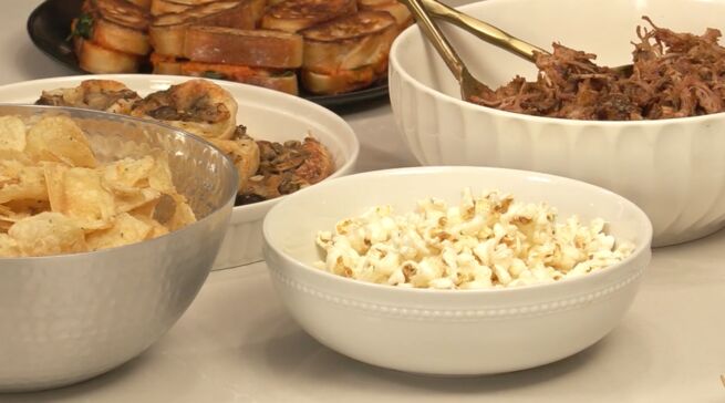 Bowl of popcorn and chips on a kitchen counter