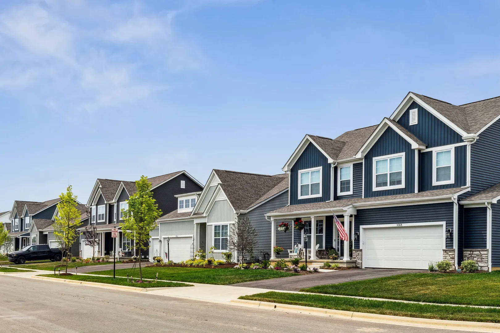 Front exterior image of a single-family home with gray siding