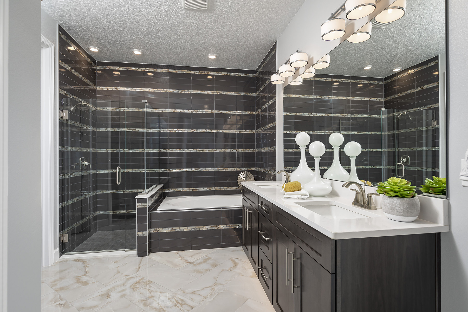 Owner's Bathroom With Dark Tile and Light-Painted Walls