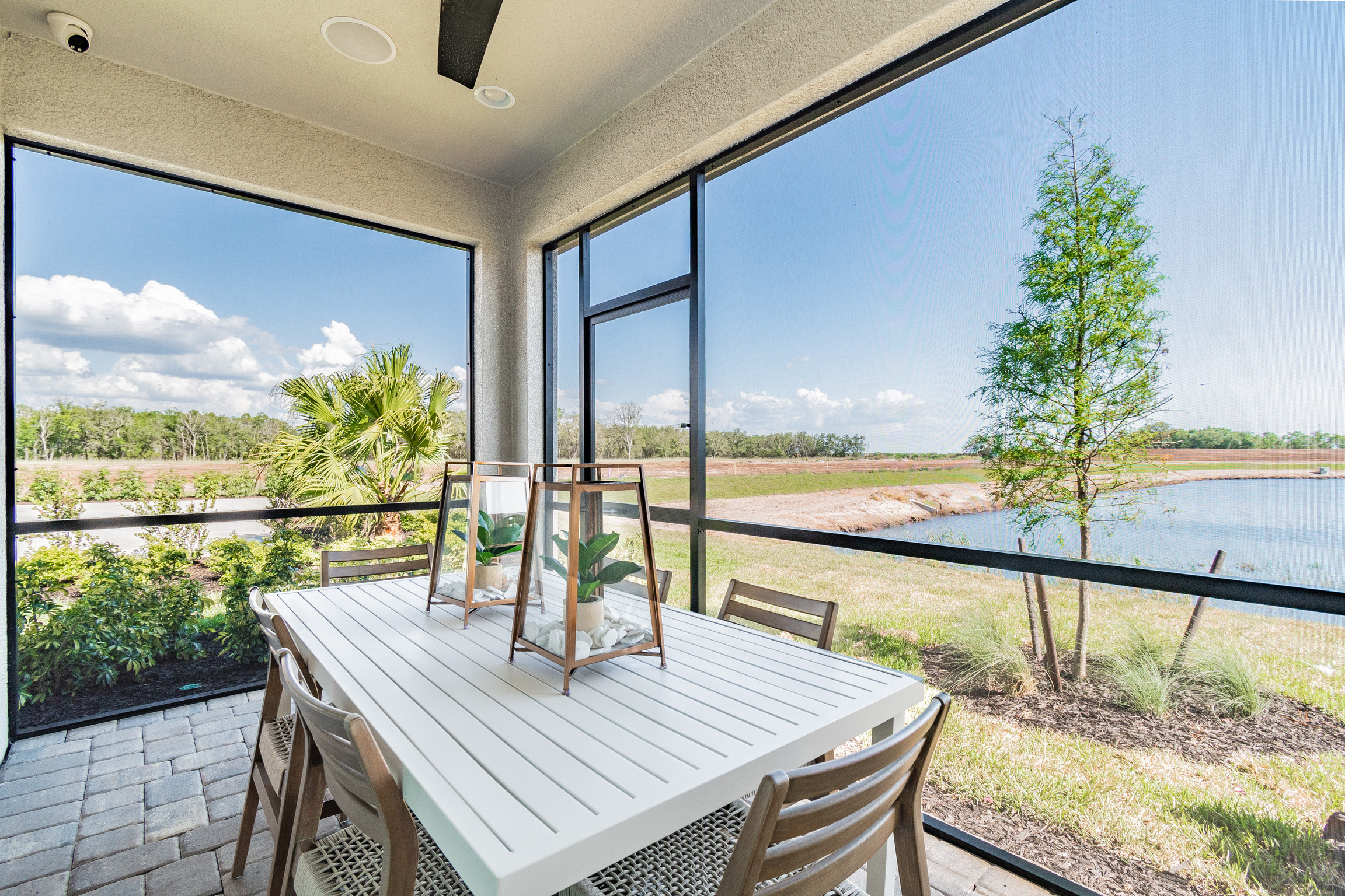 Lanai With a Table With Pond Views