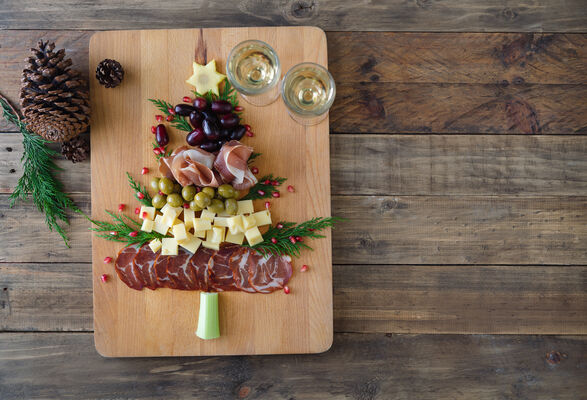 Charcuterie board in the shape of a Christmas tree