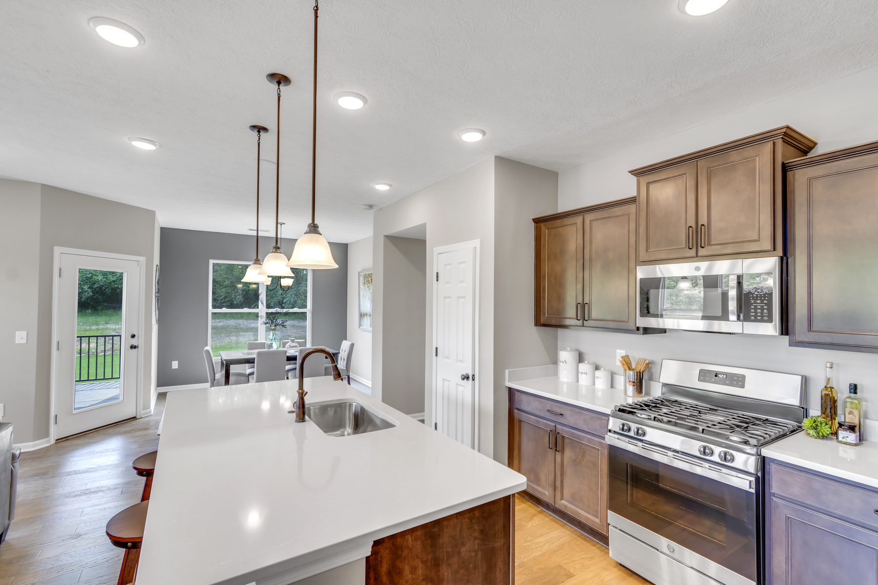 Kitchen With Dark Cabinets and Light Walls