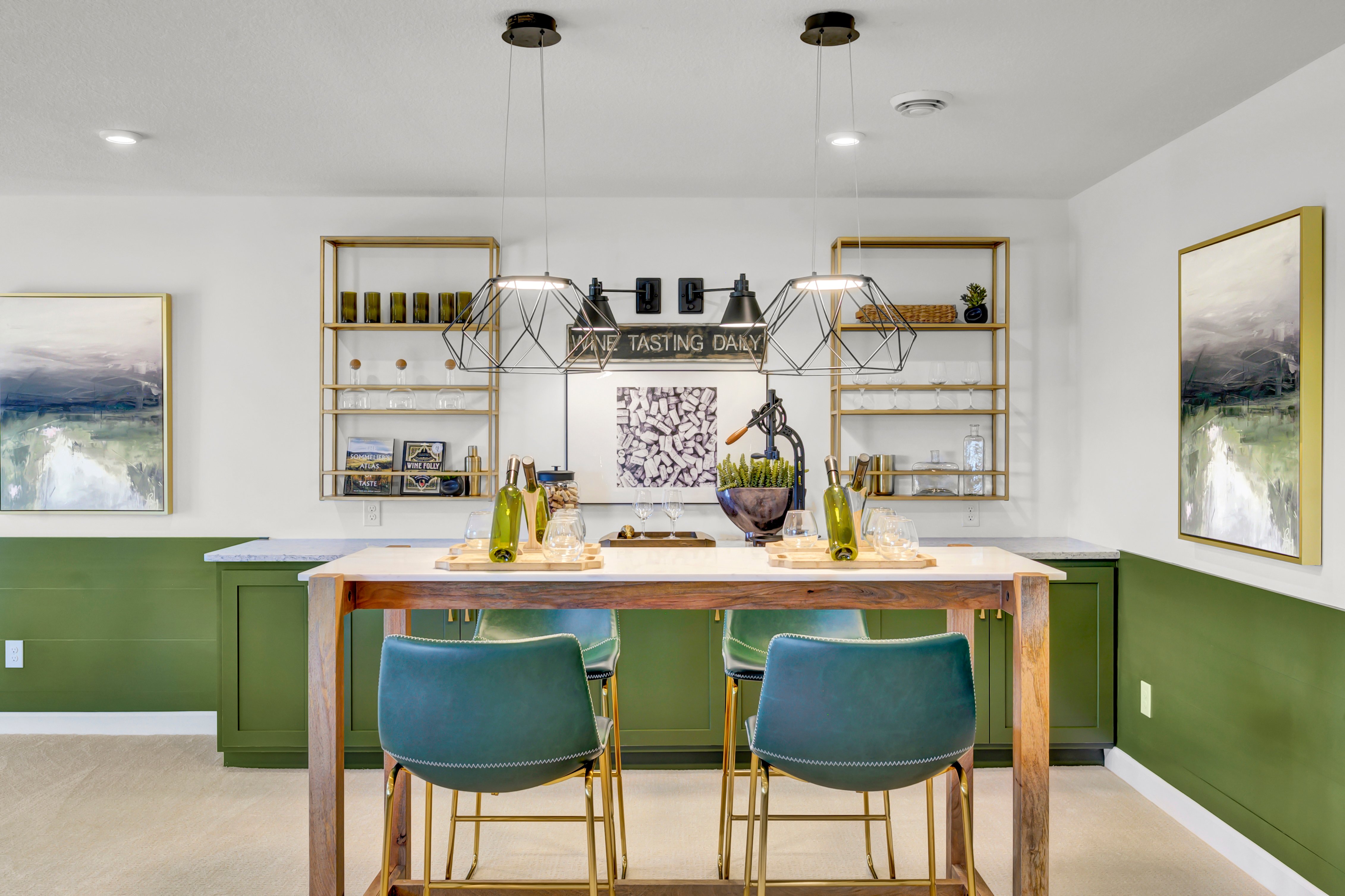 Home Bar in Basement With Green Accent Paint and Barstools