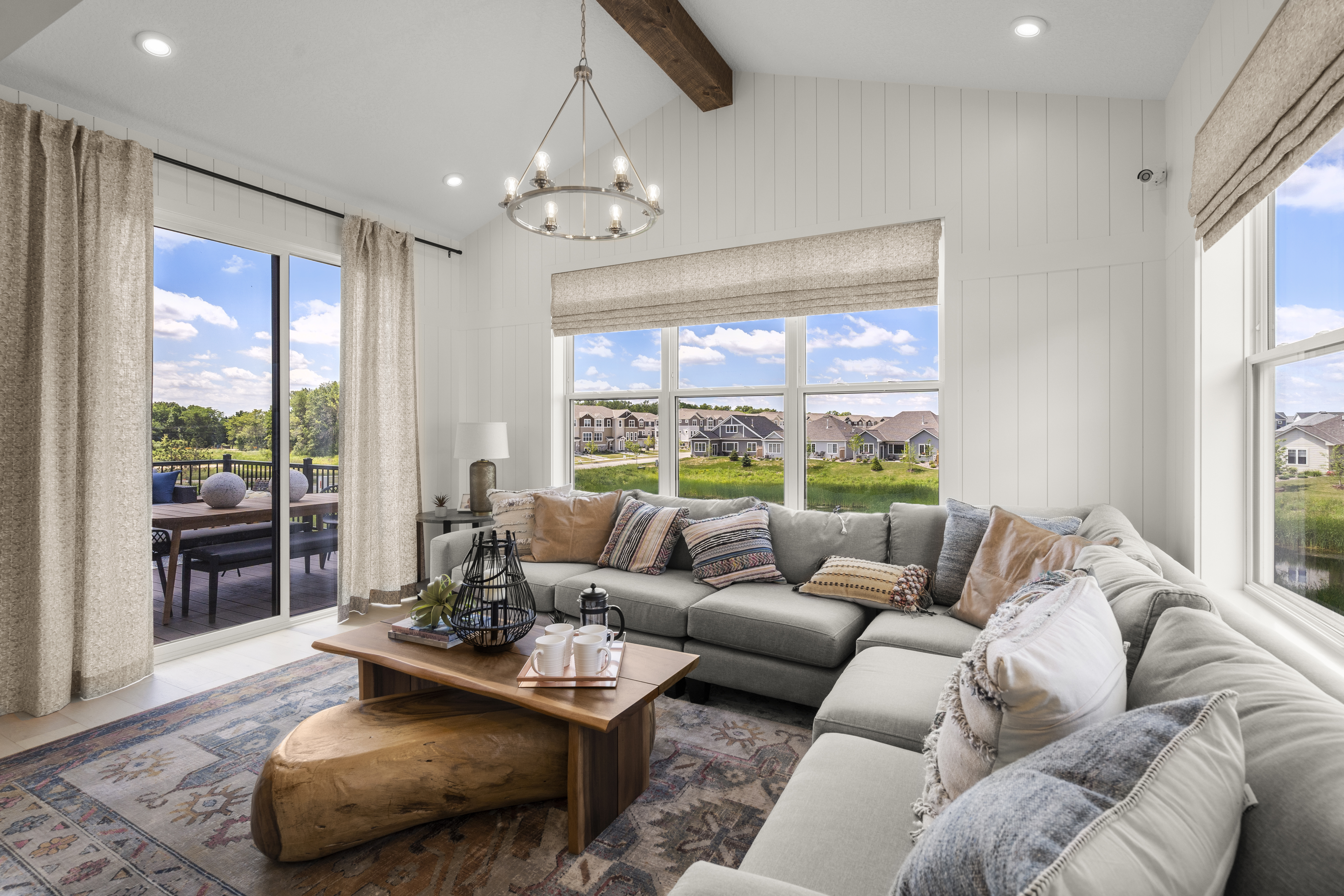 Morning Room With Large Sectional and Wooden Coffee Table