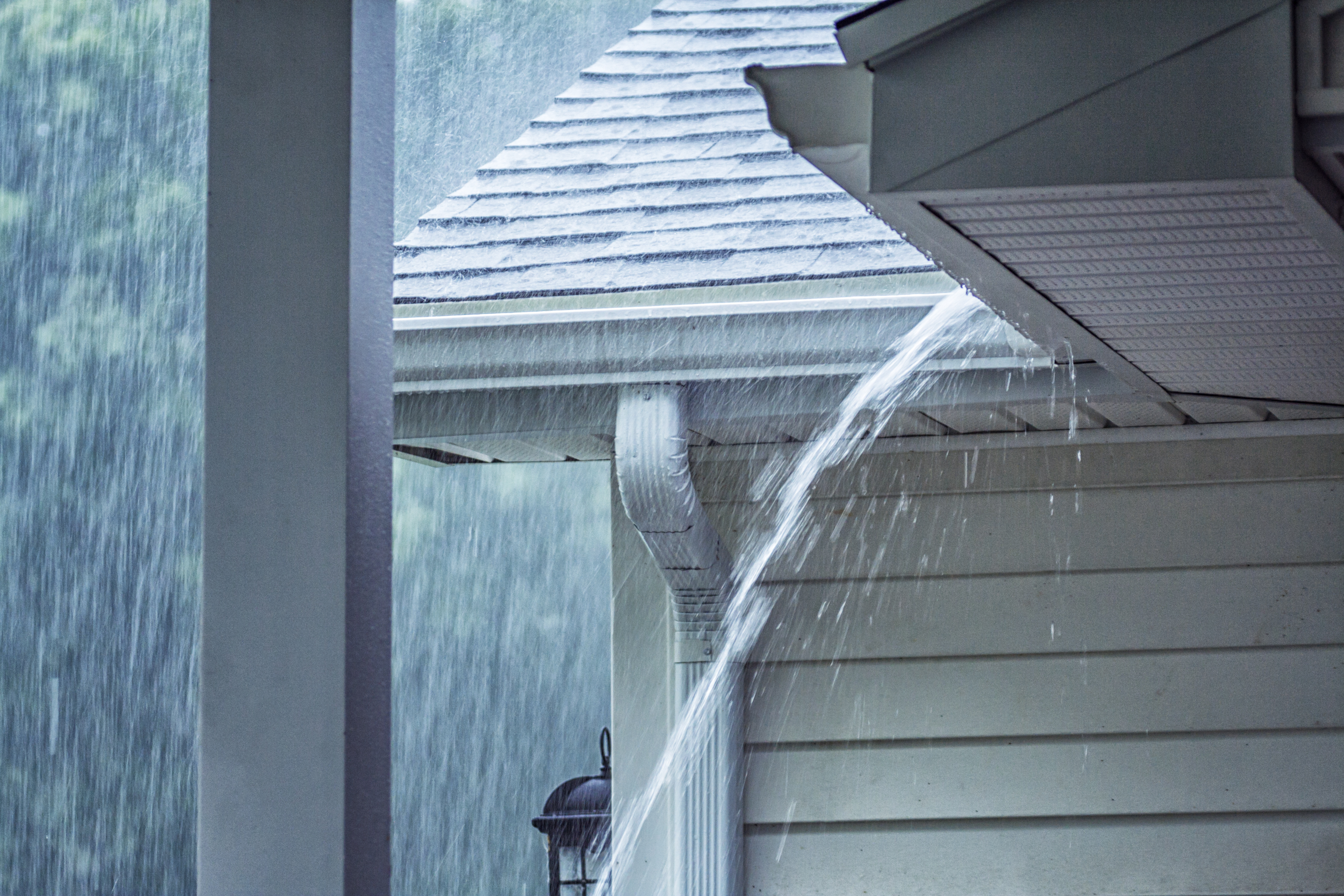 Rain Pouring Out of Gutters