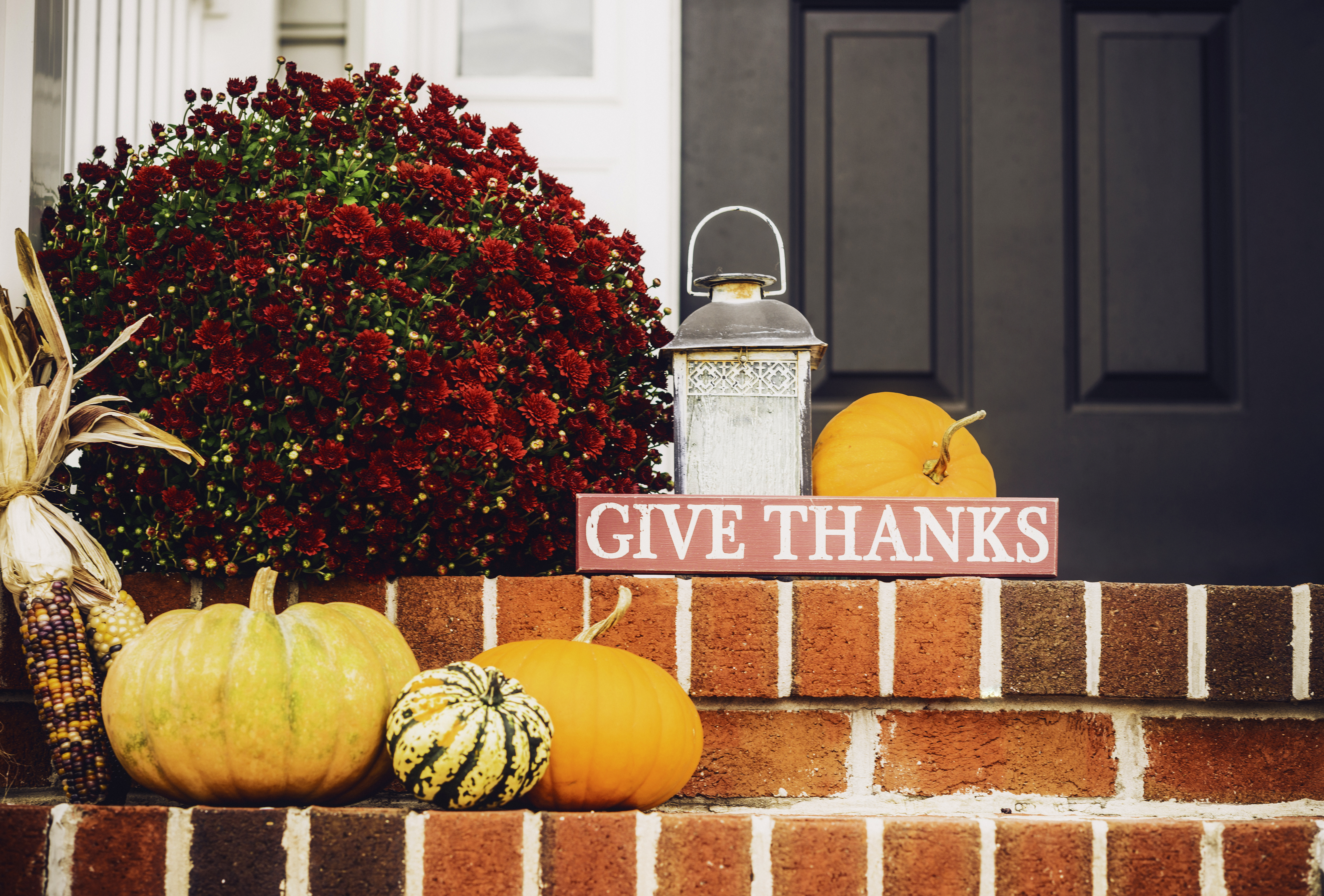 Red, Fall Décor, and Sign on Porch
