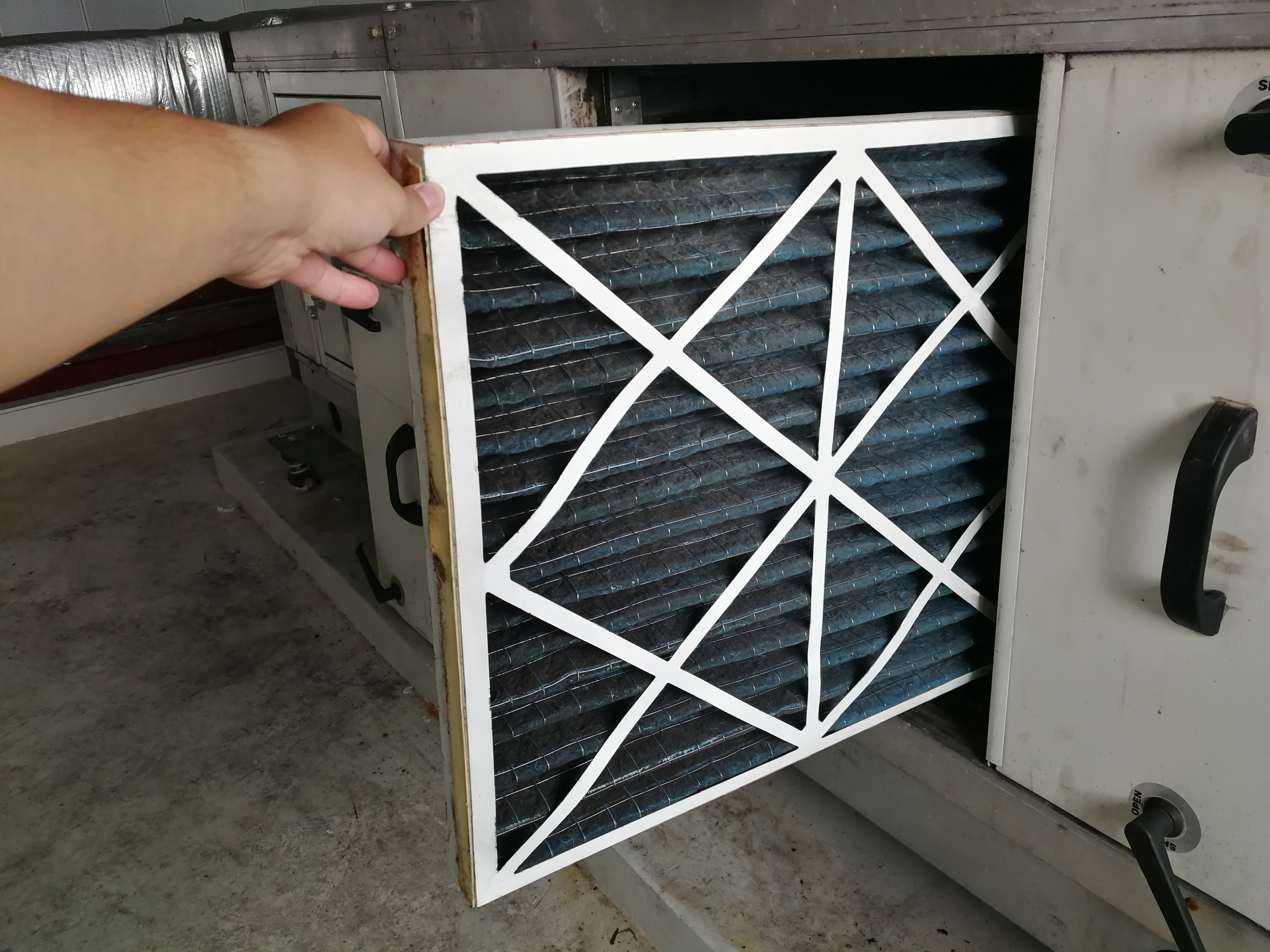 Person Changing Air Filter