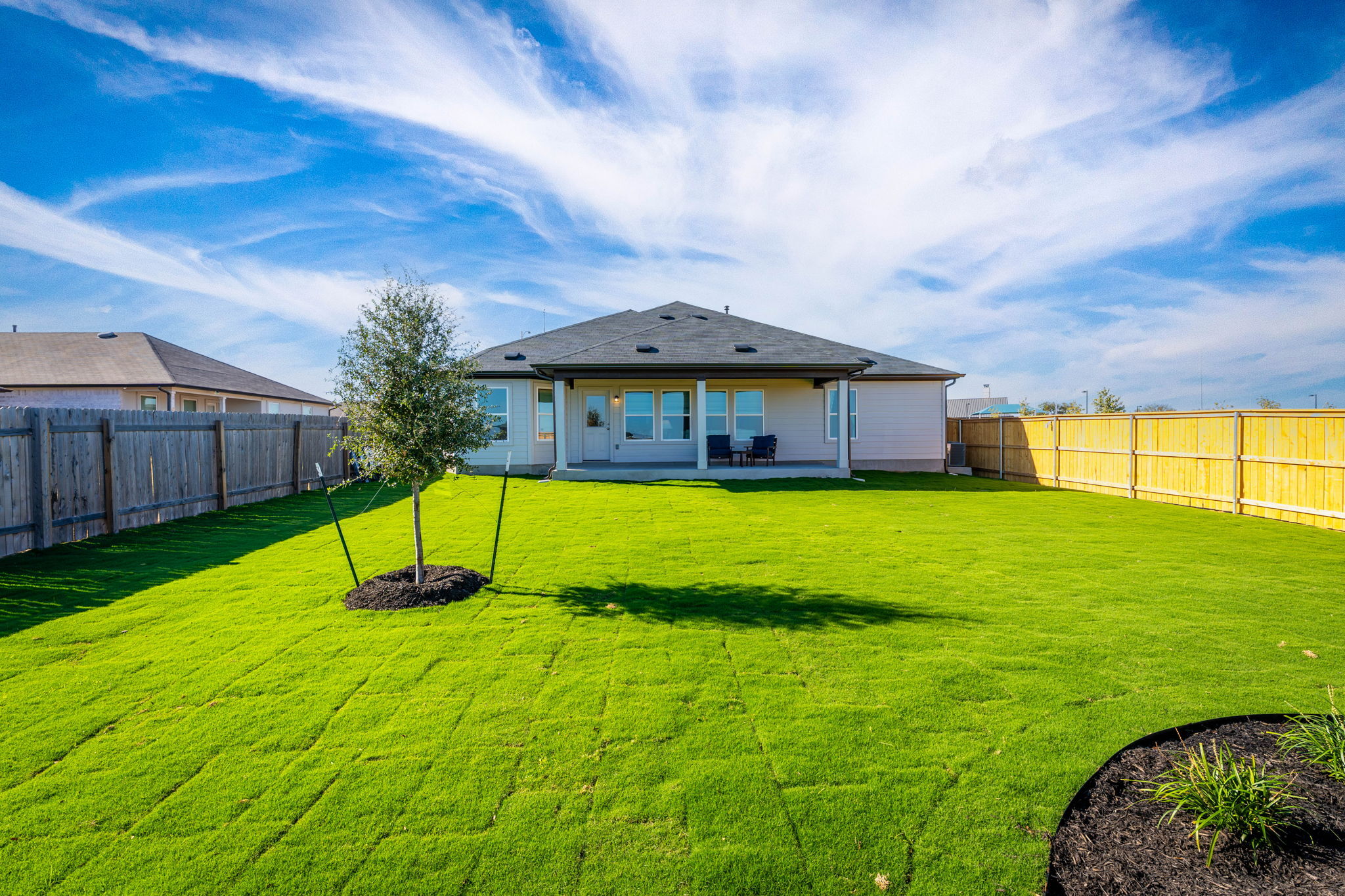 This is the back exterior of the Hawkins plan and is the model home in Carillon at 13305 Eppright...