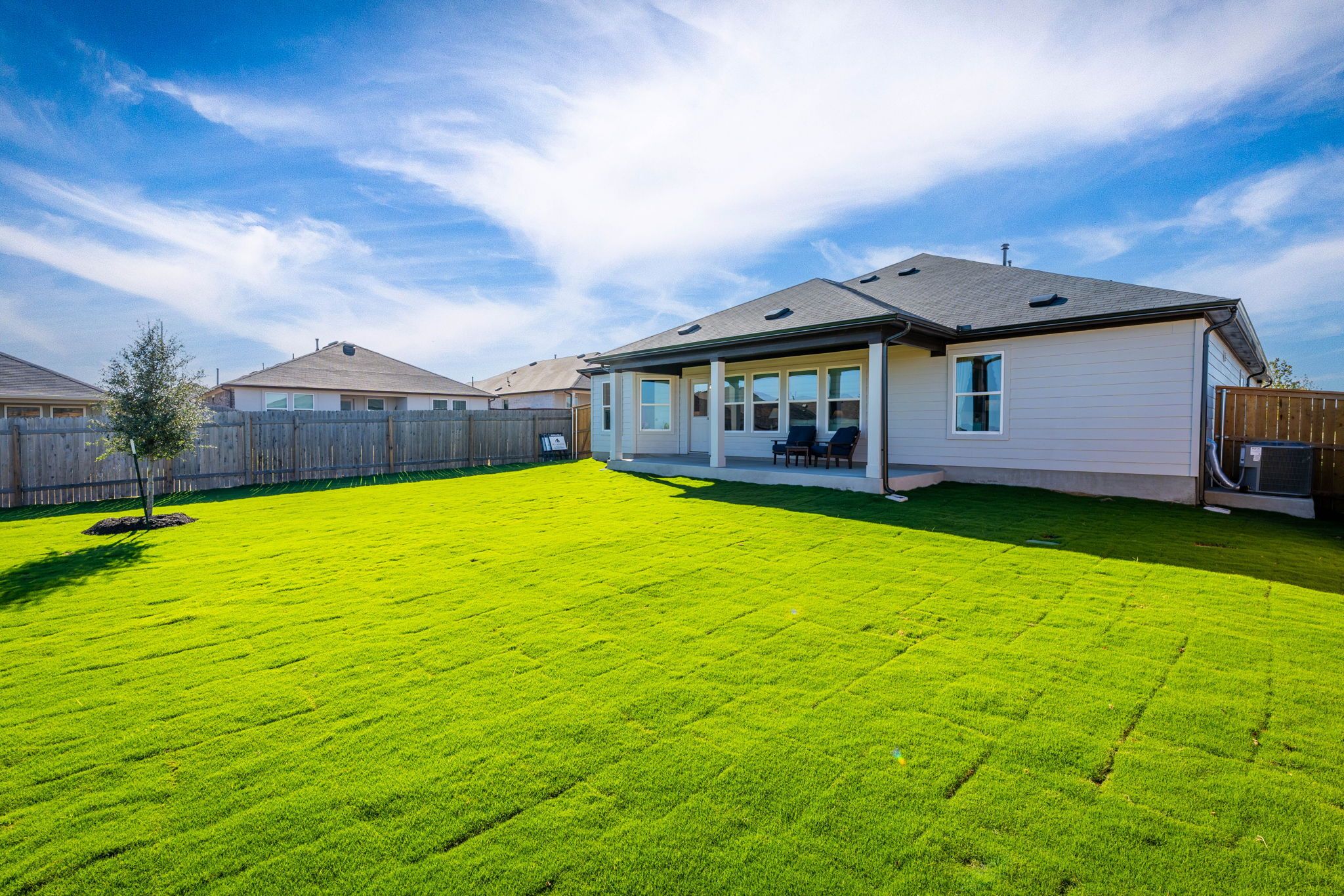 This is the back exterior of the Hawkins plan and is the model home in Carillon at 13305 Eppright...