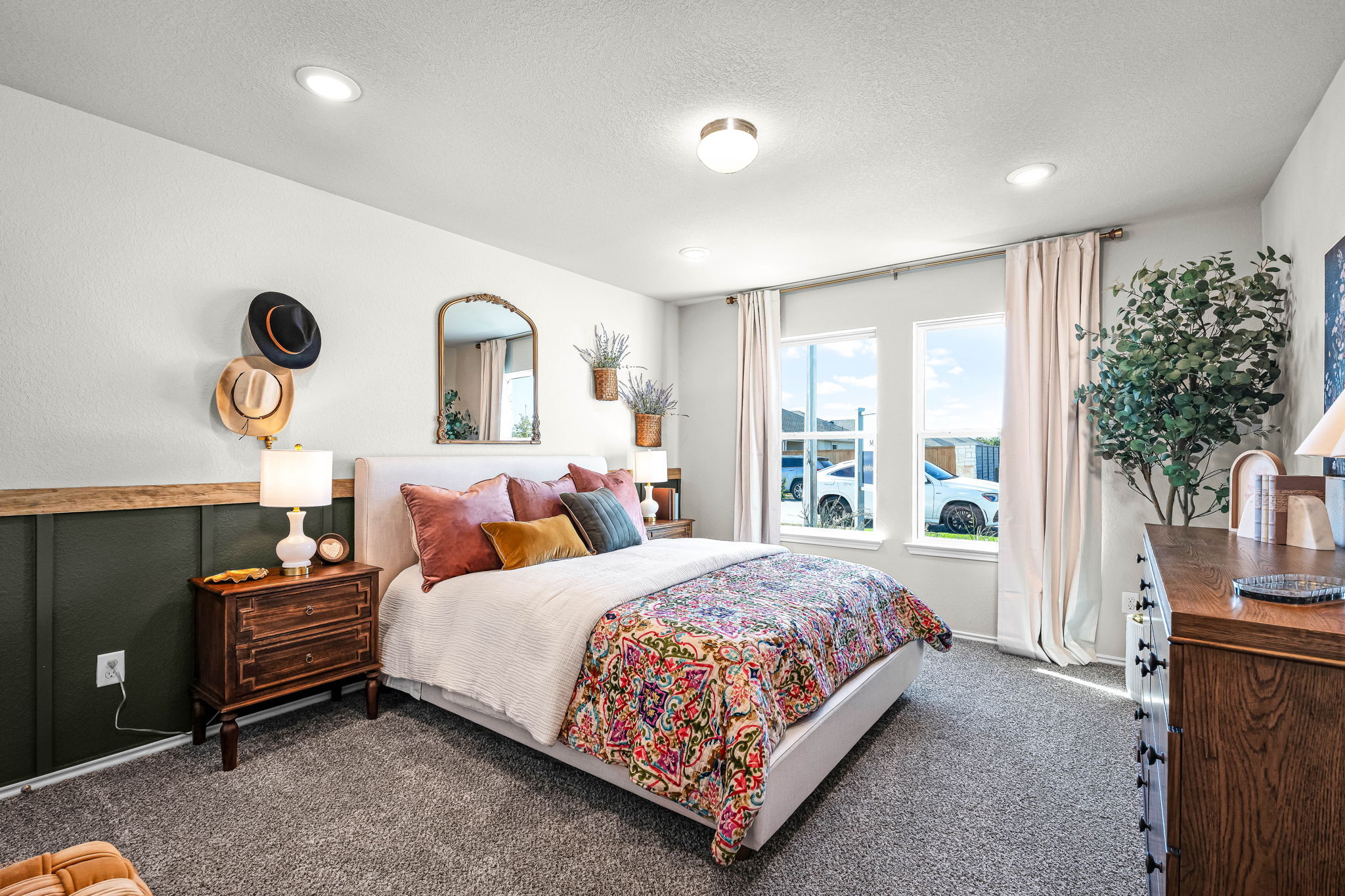 These are the secondary bedrooms of the Hawkins plan and is the model home in Carillon at 13305 E...
