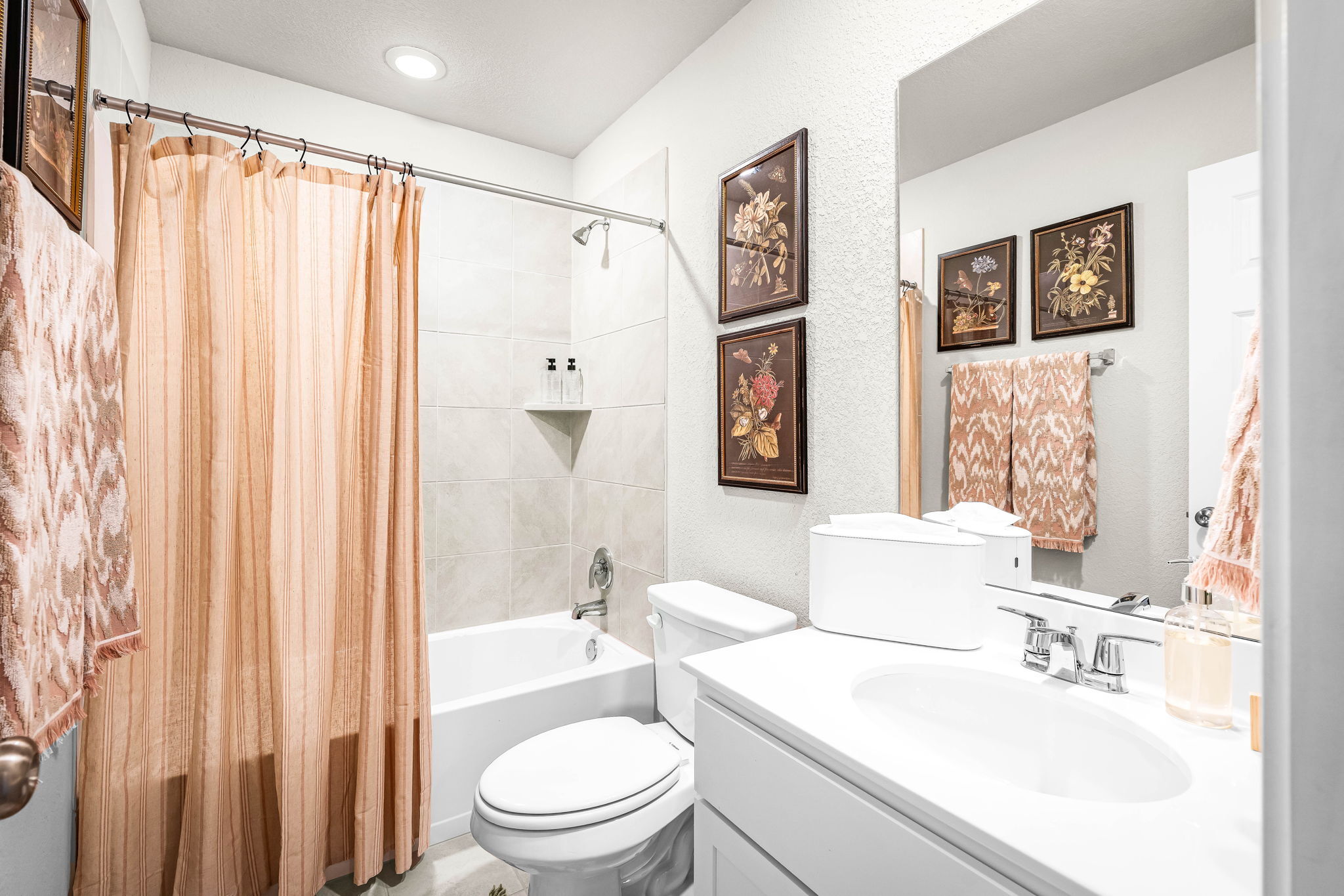 These are images of the secondary bathrooms in the Hawkins plan and is the model home in Carillon...