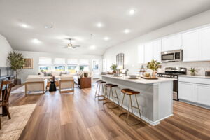 This is kitchen of the Hawkins plan and is the model home in Carillon at 13305 Eppright Trace Blvd., Manor, TX.,