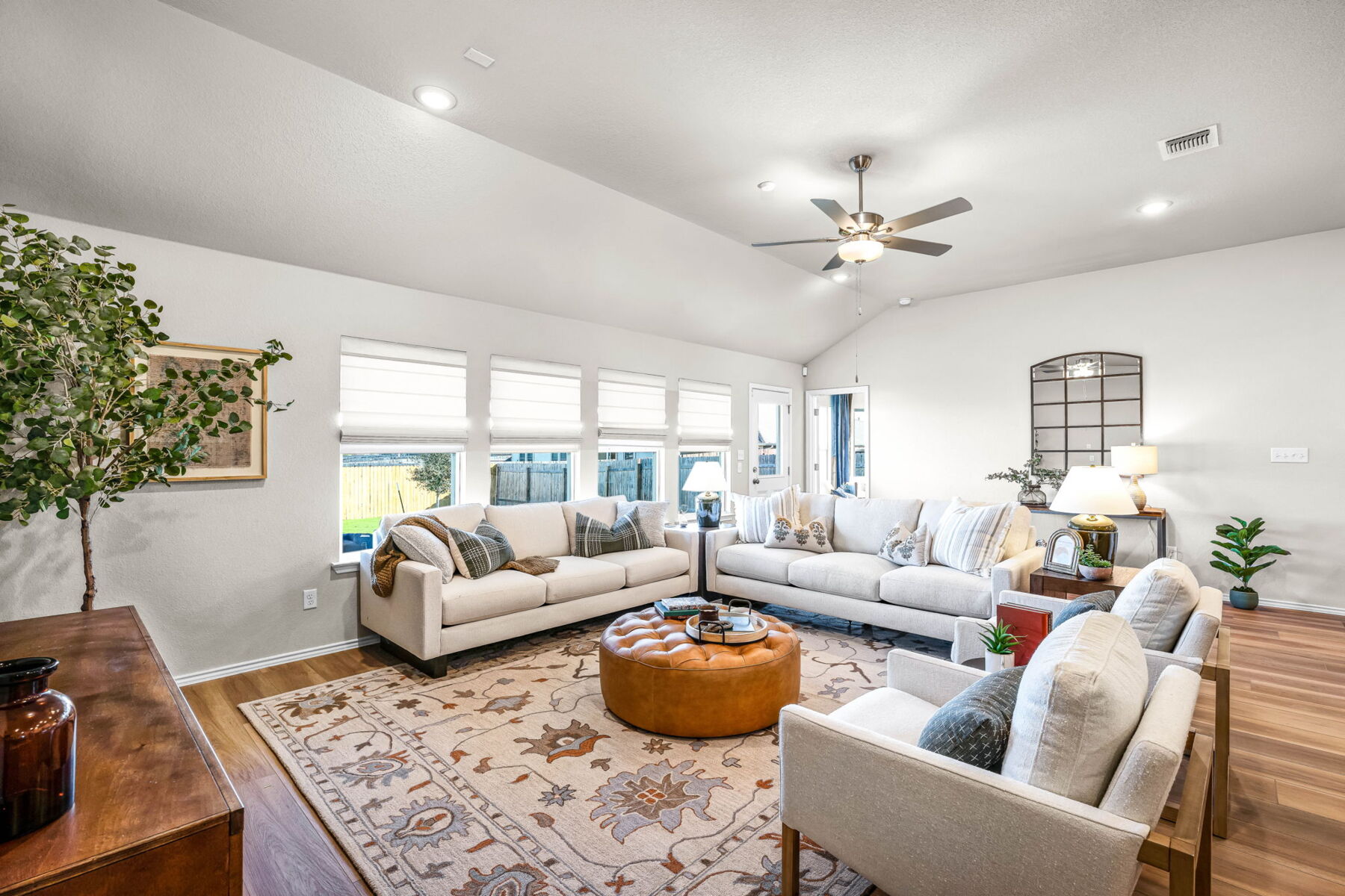 This is the living area of the Hawkins plan and is the model home in Carillon at 13305 Eppright Trace Blvd., Manor, TX.