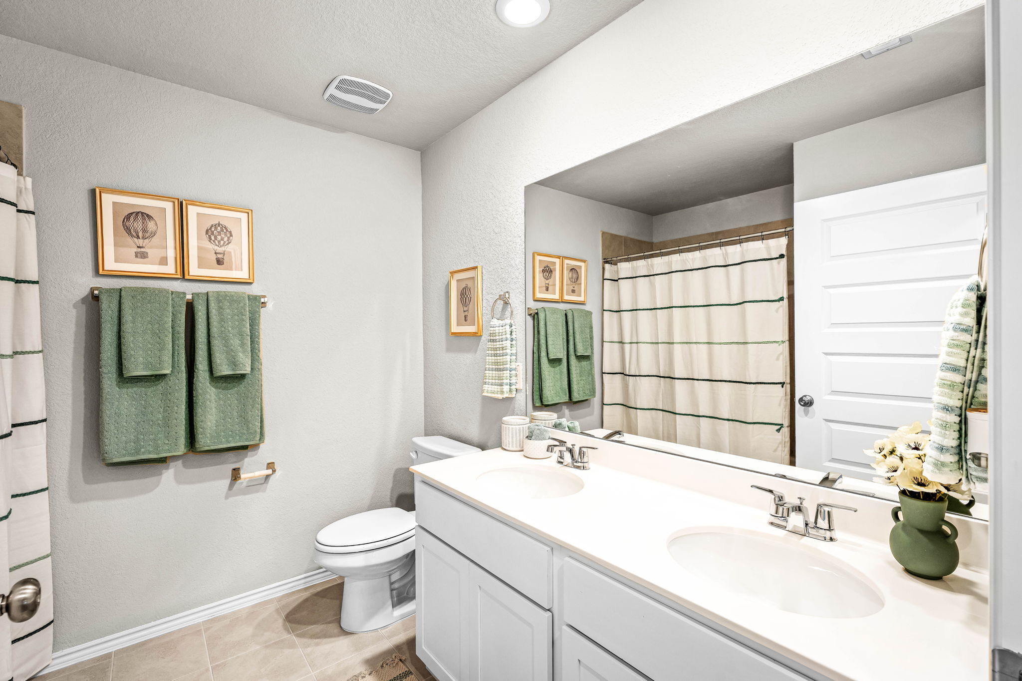 These are images of the secondary bathrooms in the Hawkins plan and is the model home in Carillon...