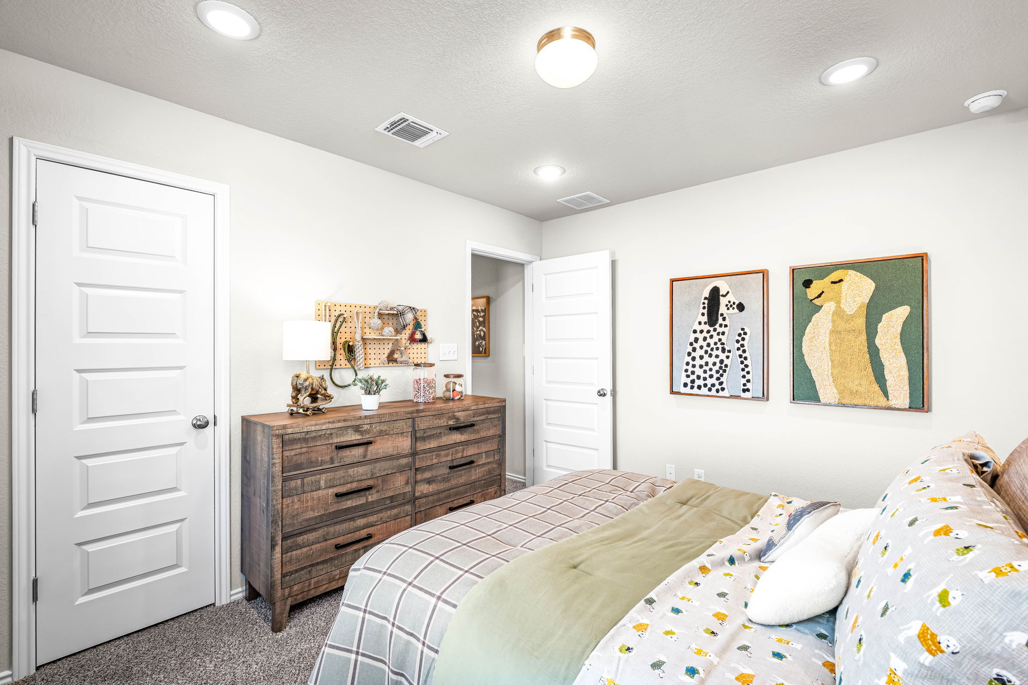 These are the secondary bedrooms of the Hawkins plan and is the model home in Carillon at 13305 E...