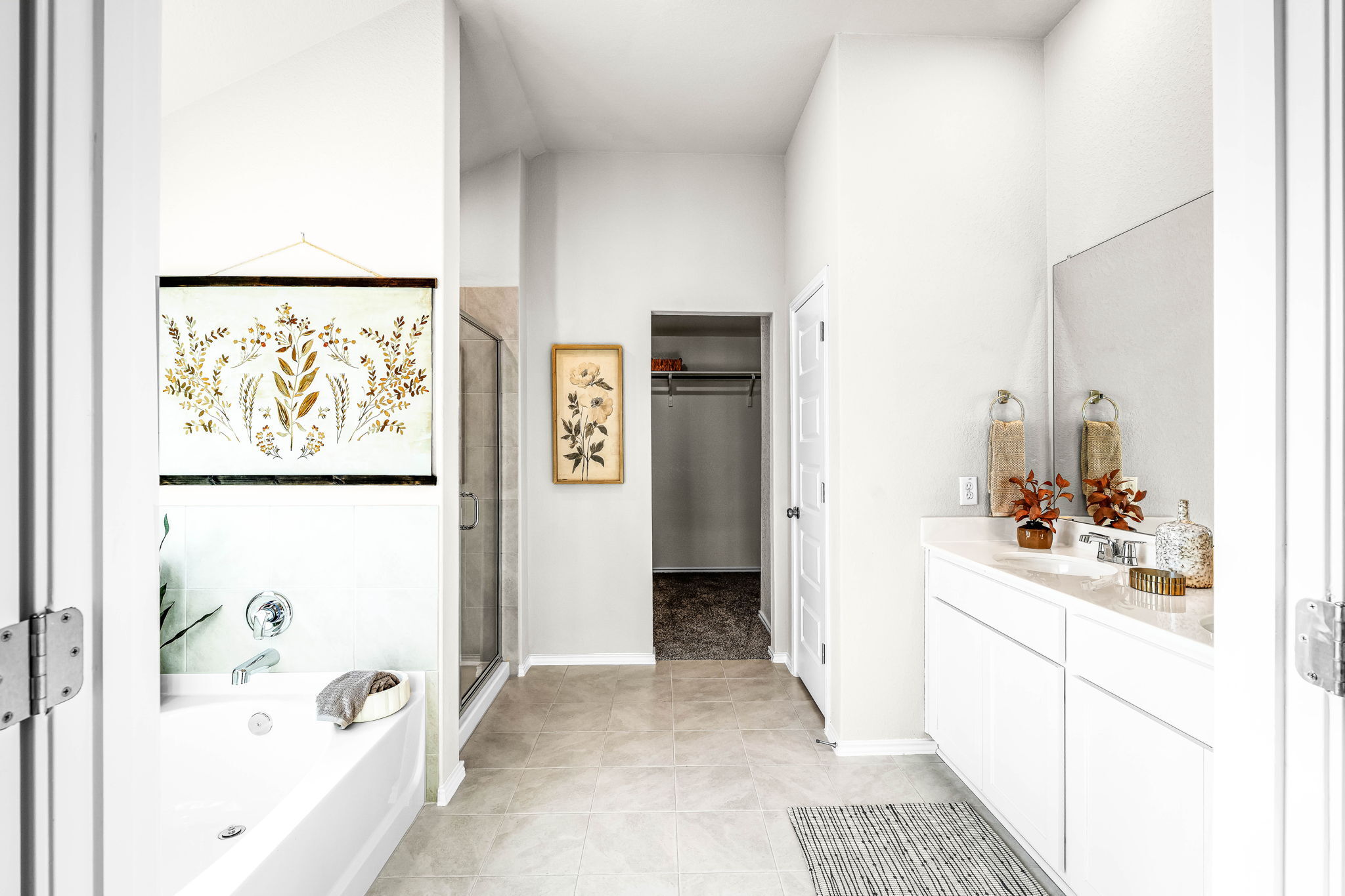 This is the primary bathroom of the Hawkins plan and is the model home in Carillon at 13305 Eppri...