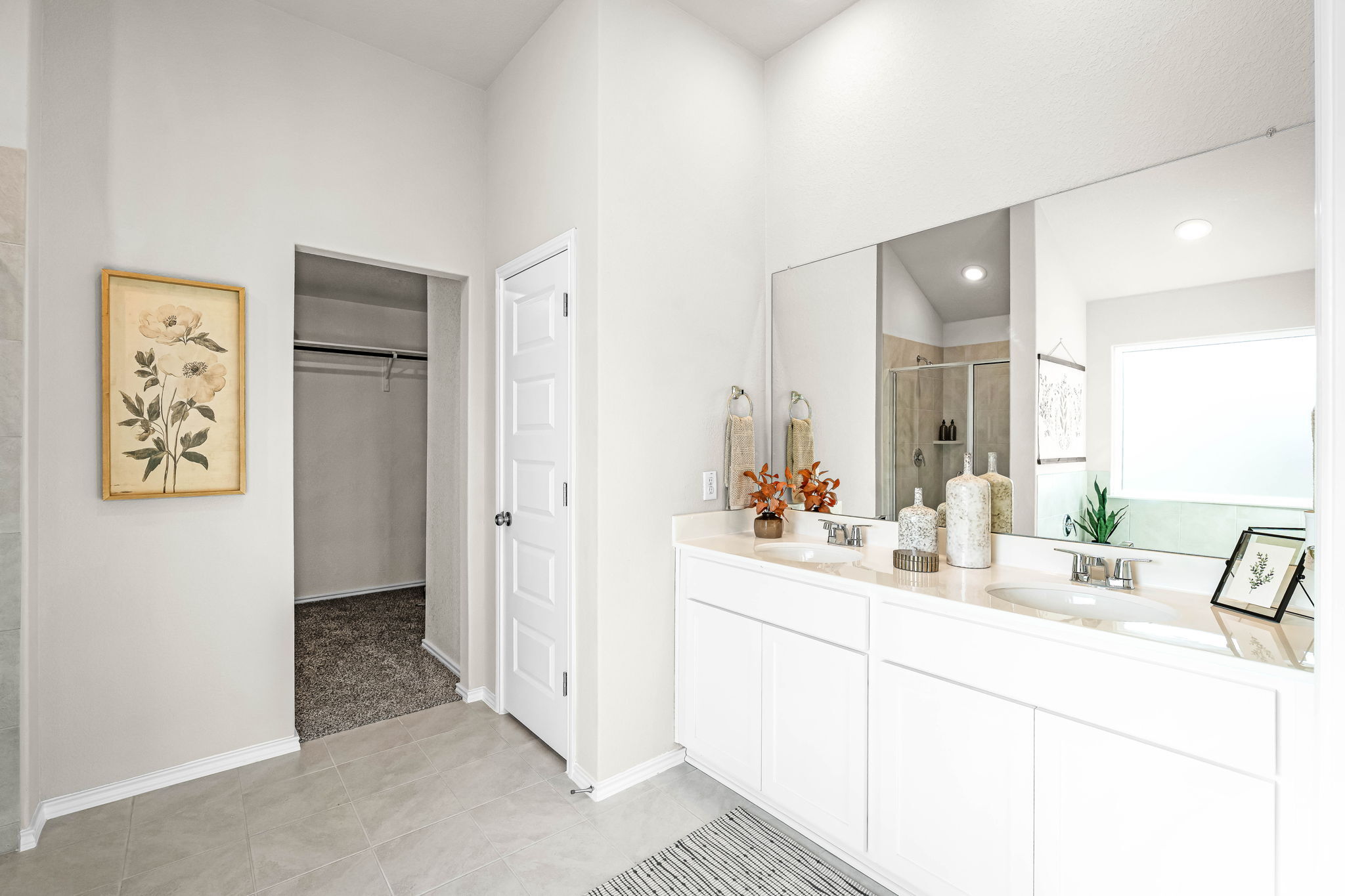 This is the primary bathroom of the Hawkins plan and is the model home in Carillon at 13305 Eppri...