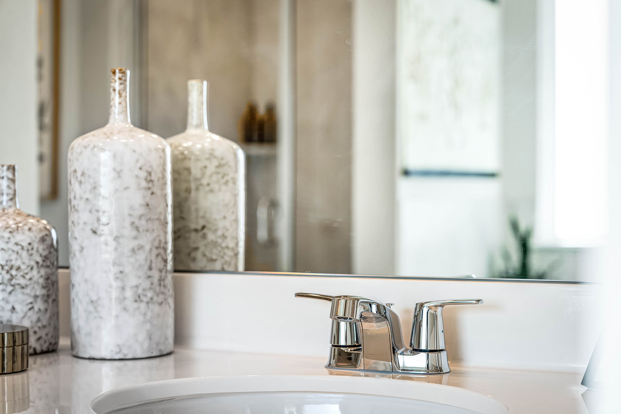 These are images of the secondary bathrooms in the Hawkins plan and is the model home in Carillon...