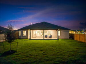 This is the back exterior of the Hawkins plan and is the model home in Carillon at 13305 Eppright Trace Blvd., Manor, TX.