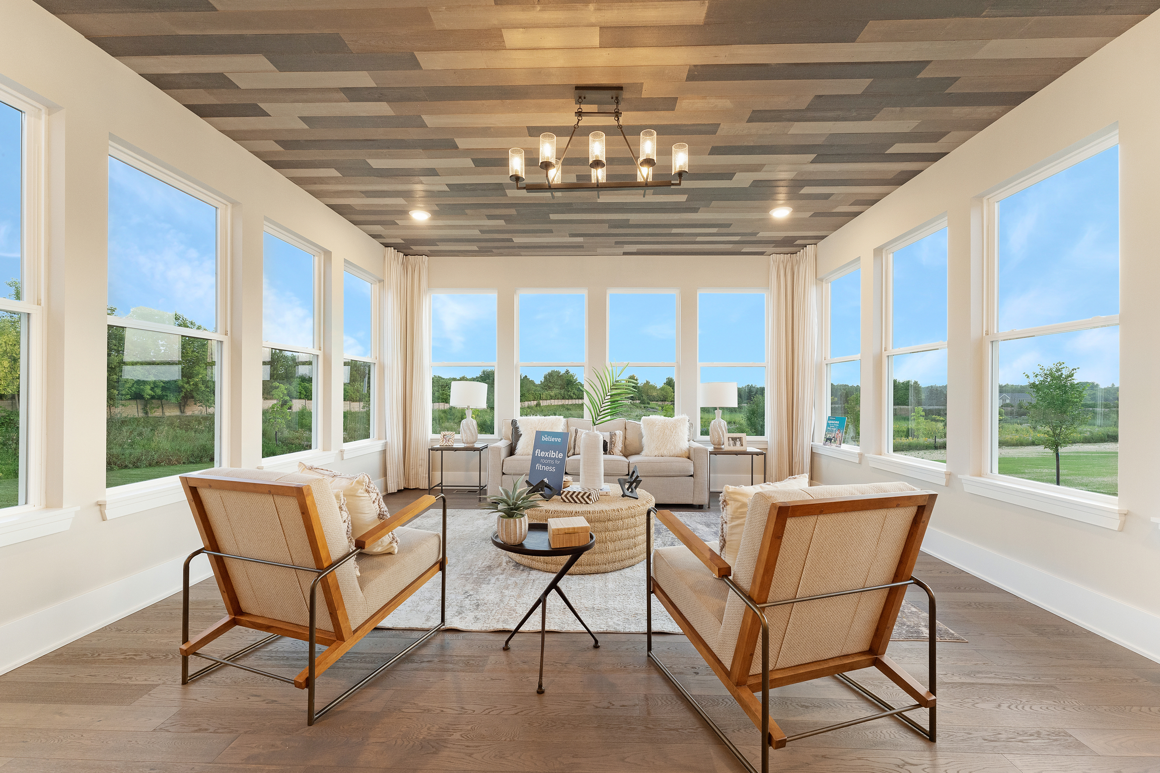 Neutral-Colored Morning Room With Rattan Accent Chairs and Statement Ceiling