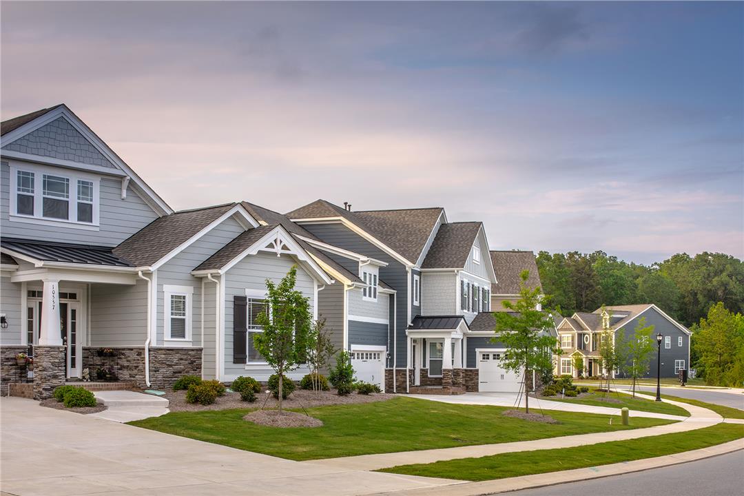 Streetscape of Gray Two Story Homes With Stone Accents