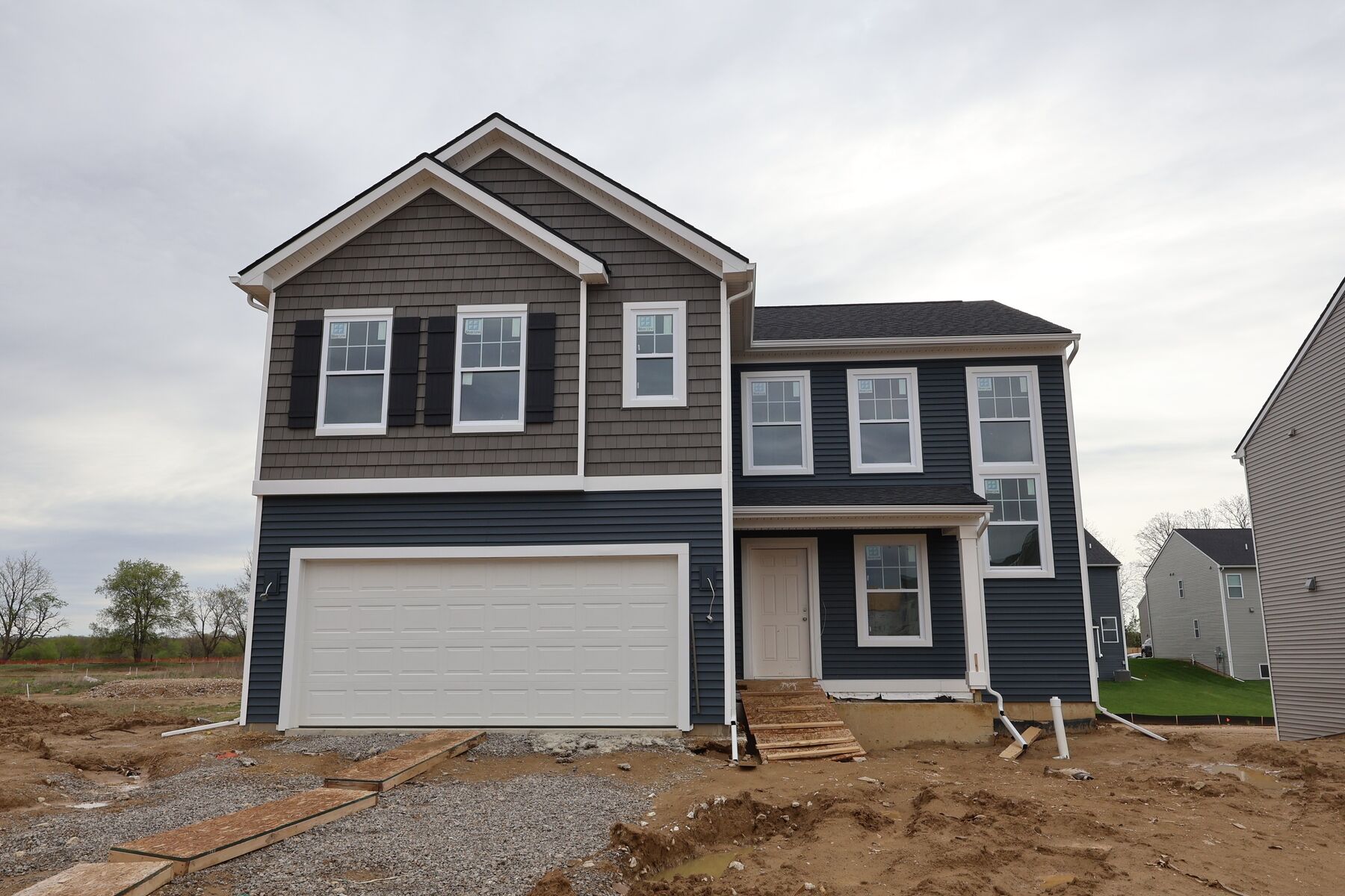 MLS #20261021732 - 717 Whisperwood Way Chelsea, MI 48118 - M/I Homes